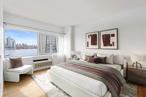 a bedroom with a bed and glass window