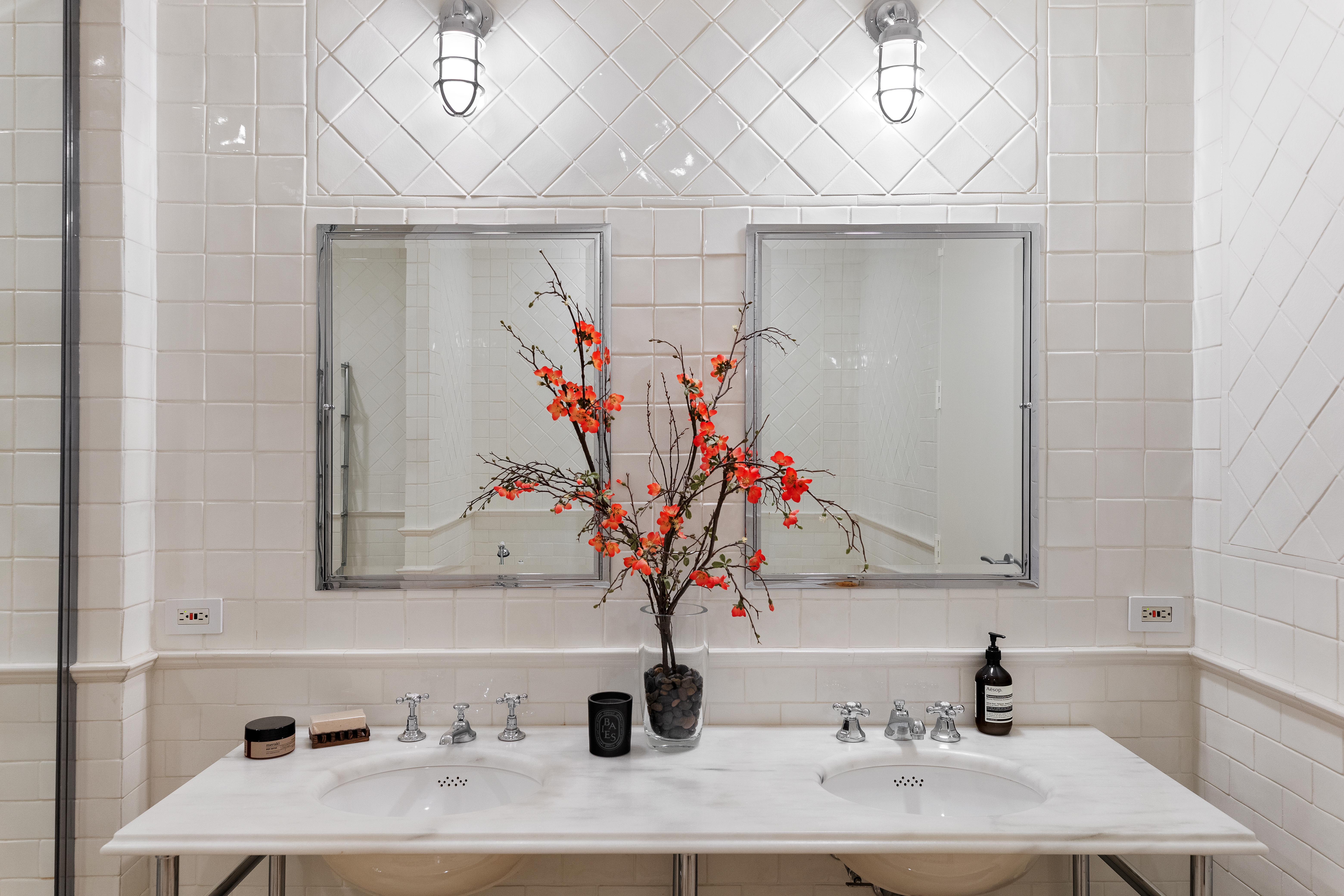 388 West Broadway, Unit 2 Manhattan, NY 10012 - Photo 18 of 27 a bathroom with a sink and a mirror