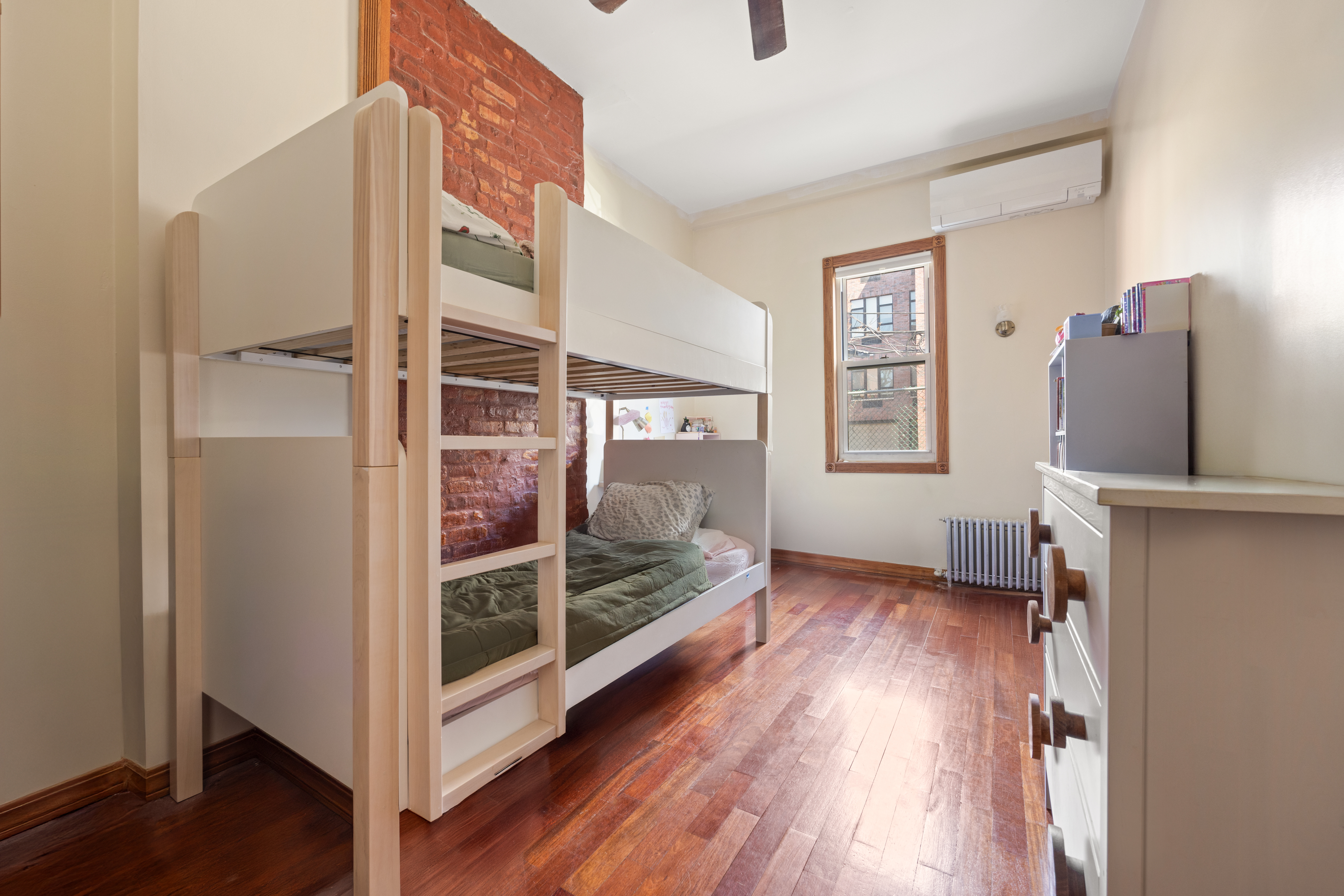 219 16th Street, Unit 1 Brooklyn, NY 11215 - Photo 5 of 7 a view of livingroom with hardwood floor and window