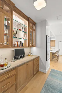 a room with a couch and a view of living room