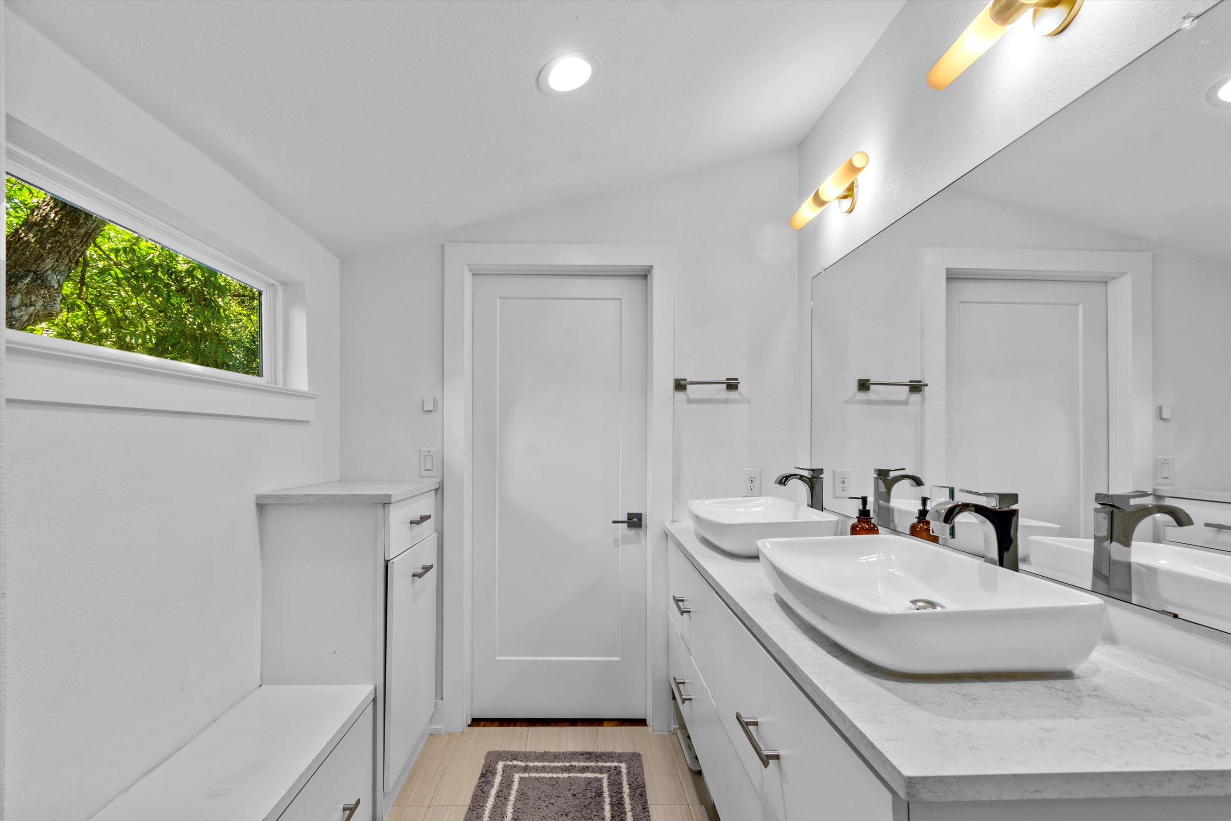 2712 Oak Springs Drive, Unit A Austin, TX 78702 - Photo 9 of 26 a bathroom with a sink and a mirror