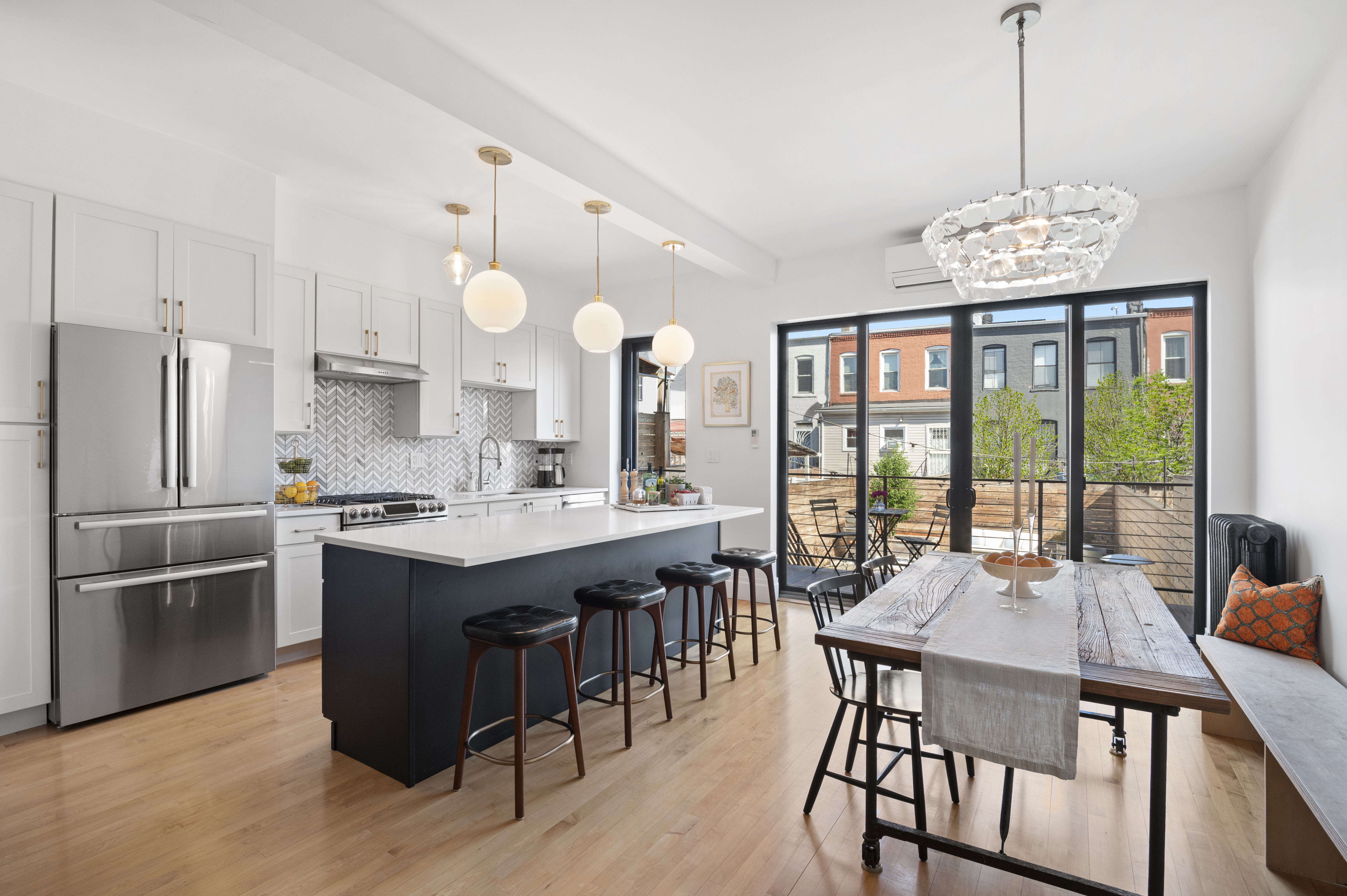 185 East 31st Street Brooklyn, NY 11226 - Photo 1 of 23 a kitchen with a table chairs stove and refrigerator
