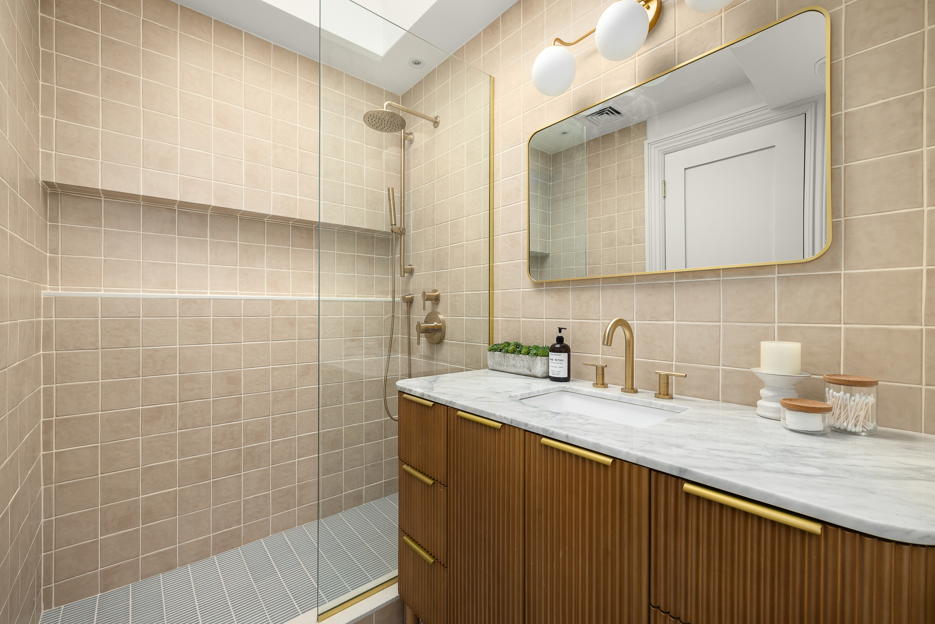 485 Halsey Street Brooklyn, NY 11233 - Photo 13 of 17 a bathroom with a granite countertop sink a mirror and a shower