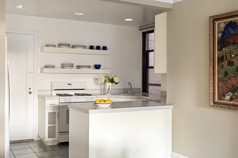 a kitchen with stainless steel appliances a refrigerator and a stove