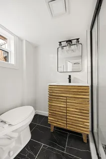 a bathroom with a sink and a toilet