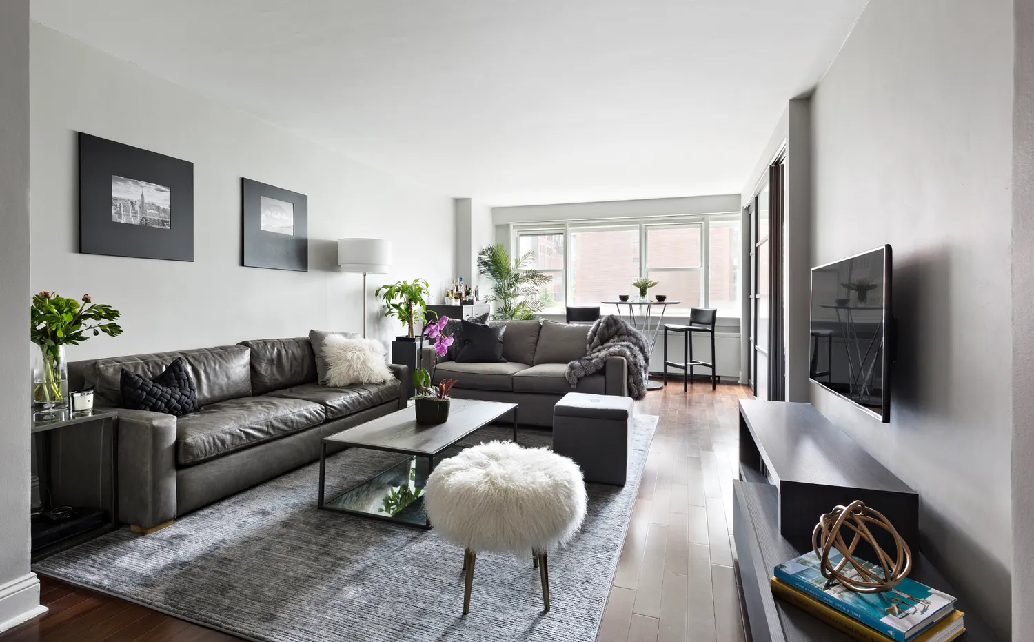a living room with furniture fireplace and a flat screen tv