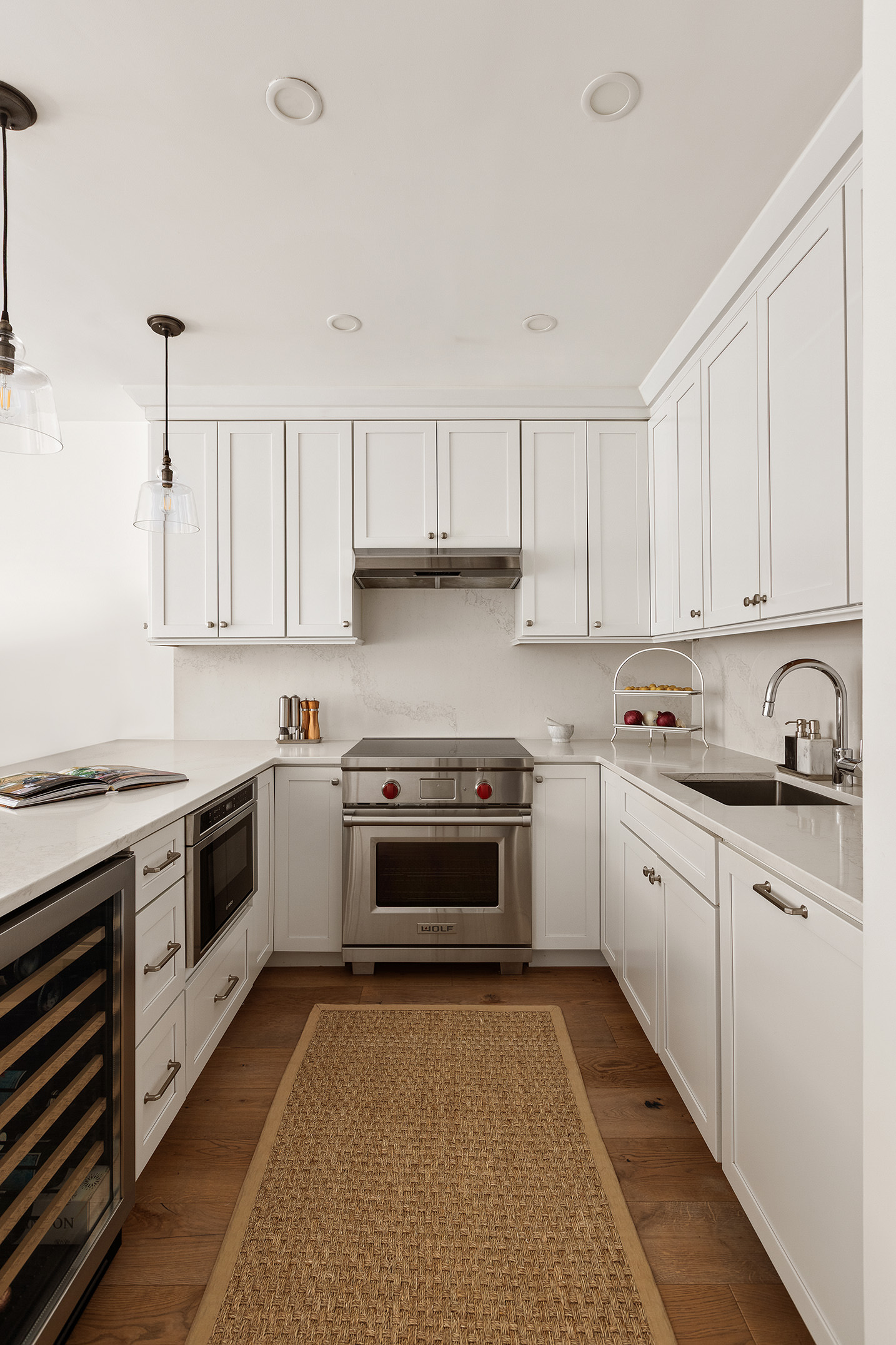 331 West 14th Street, Unit 4AB Manhattan, NY 10014 - Photo 3 of 11 a kitchen with granite countertop white cabinets and white appliances