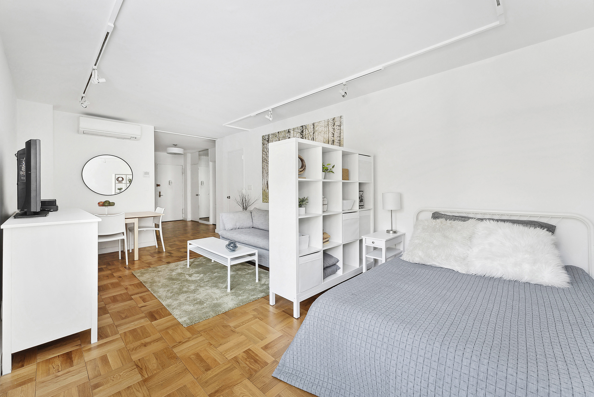 2 5th Avenue, Unit 2U Manhattan, NY 10011 - Photo 2 of 13 a bedroom with furniture and a large window