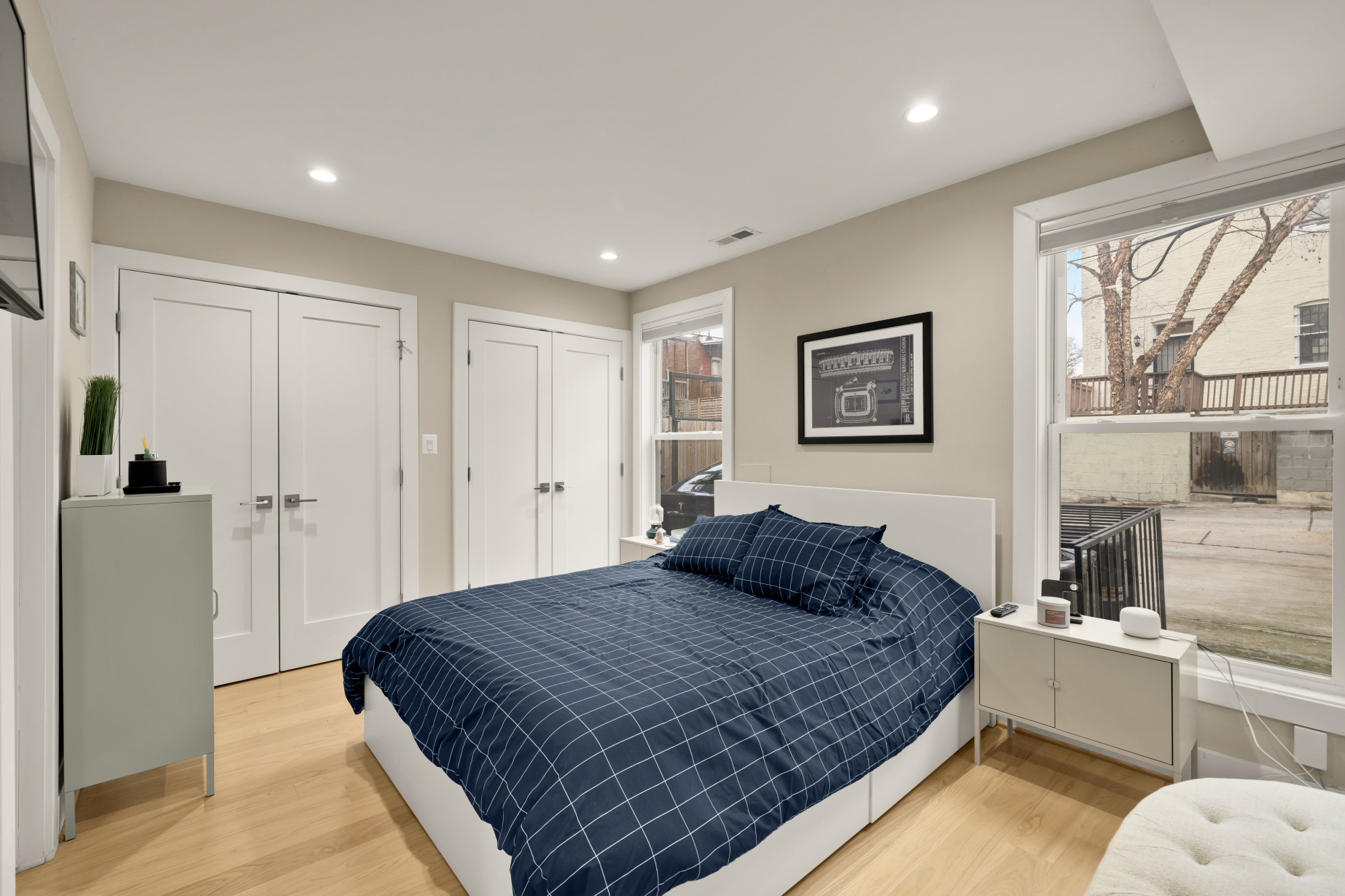 14 T Street Northeast, Unit 1 Washington, DC 20002 - Photo 29 of 39 a bedroom with a large bed and a large window