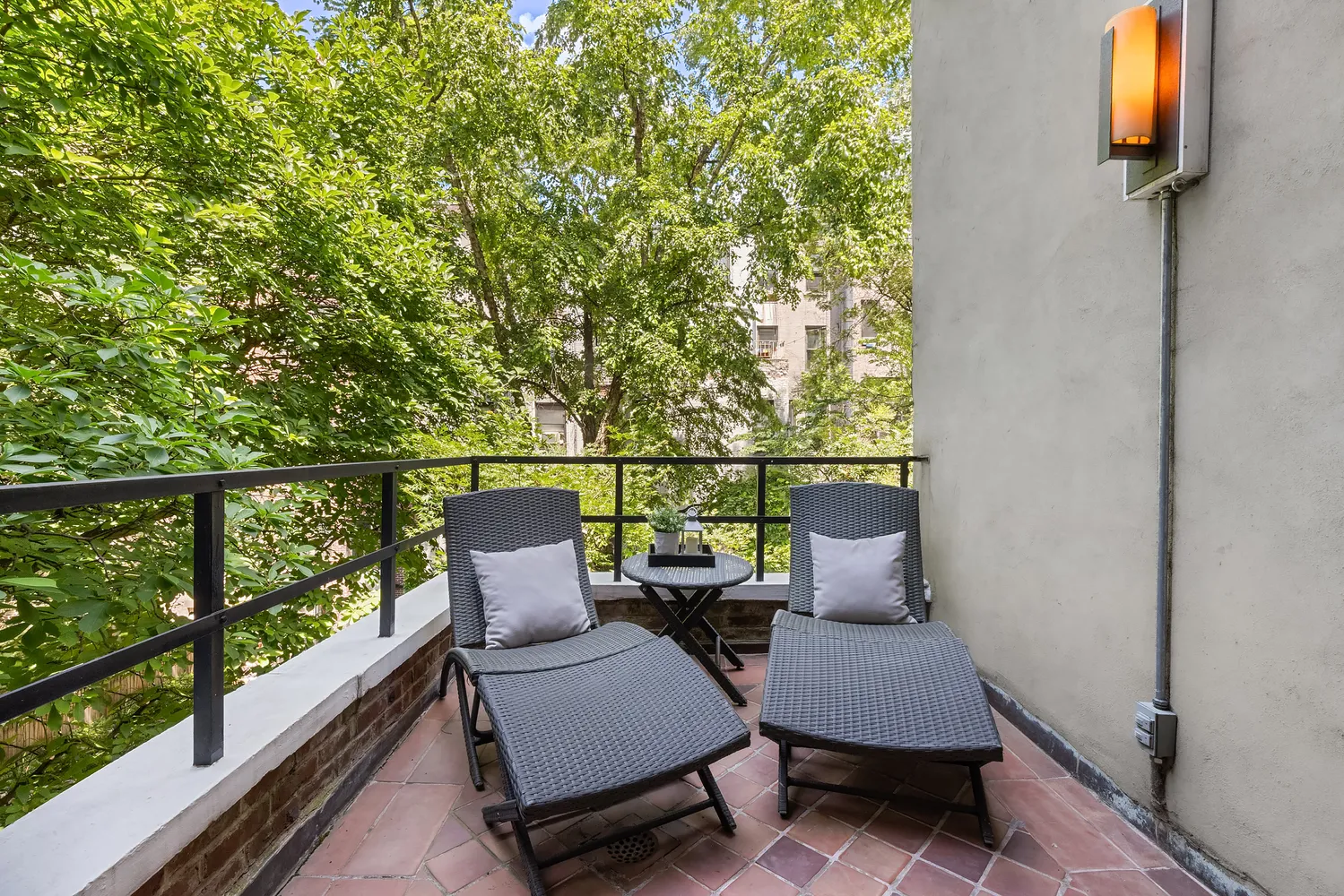a view of a chair and table in the balcony