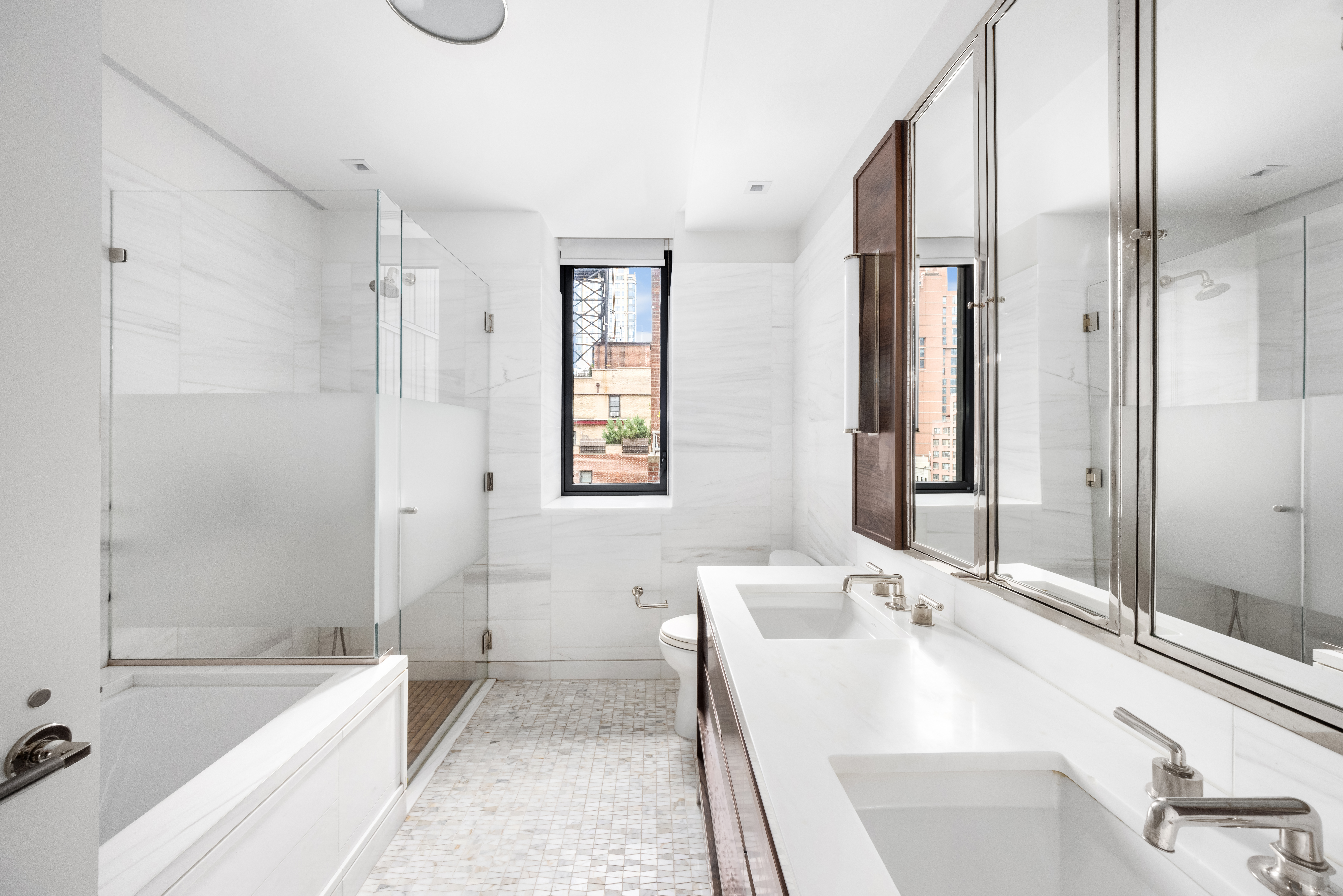 301 East 50th Street, Unit 8C Manhattan, NY 10022 - Photo 11 of 20 a bathroom with a bathtub and a sink
