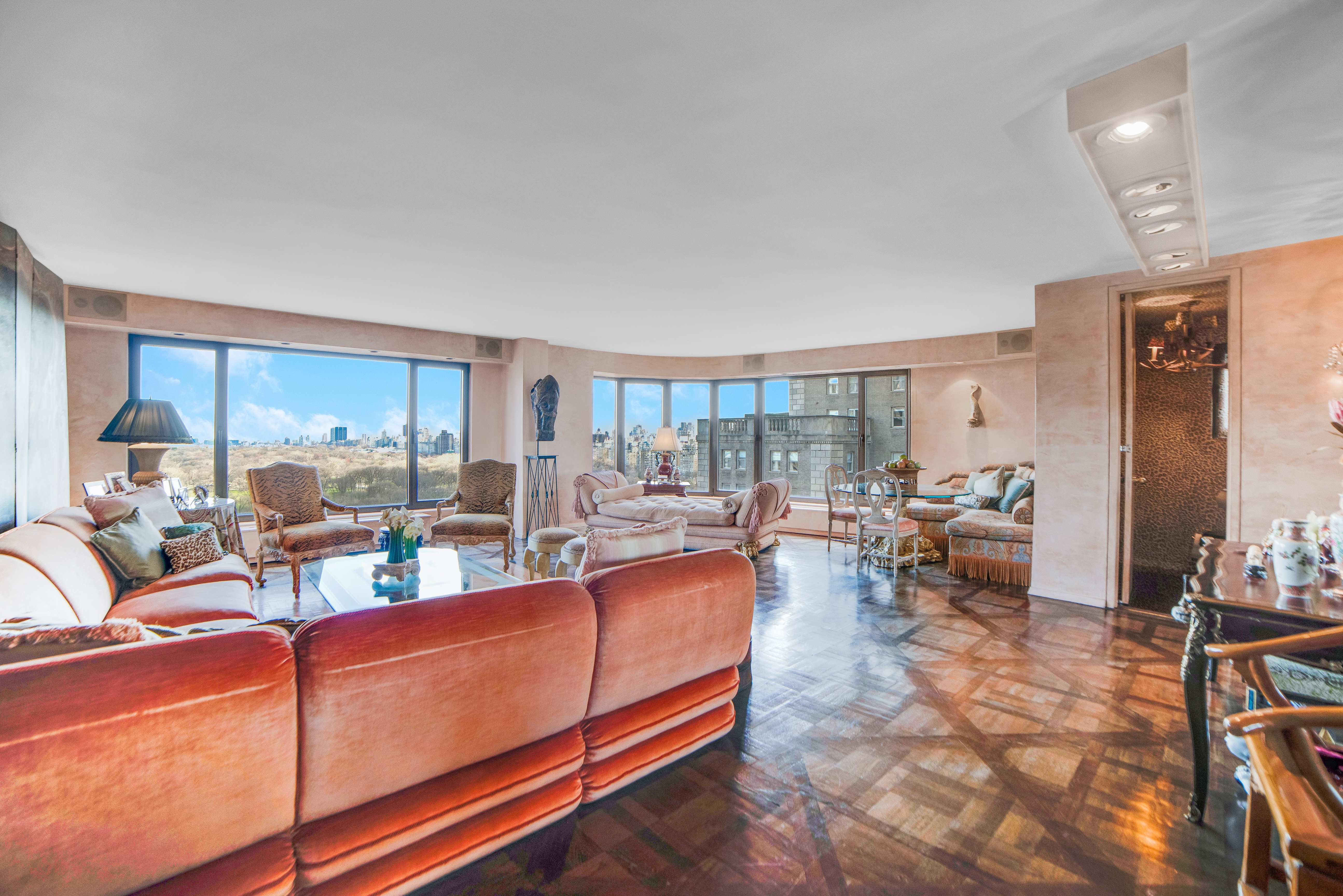 200 Central Park South, Unit 24A Manhattan, NY 10019 - Photo 2 of 23 a living room with furniture kitchen view and a large window