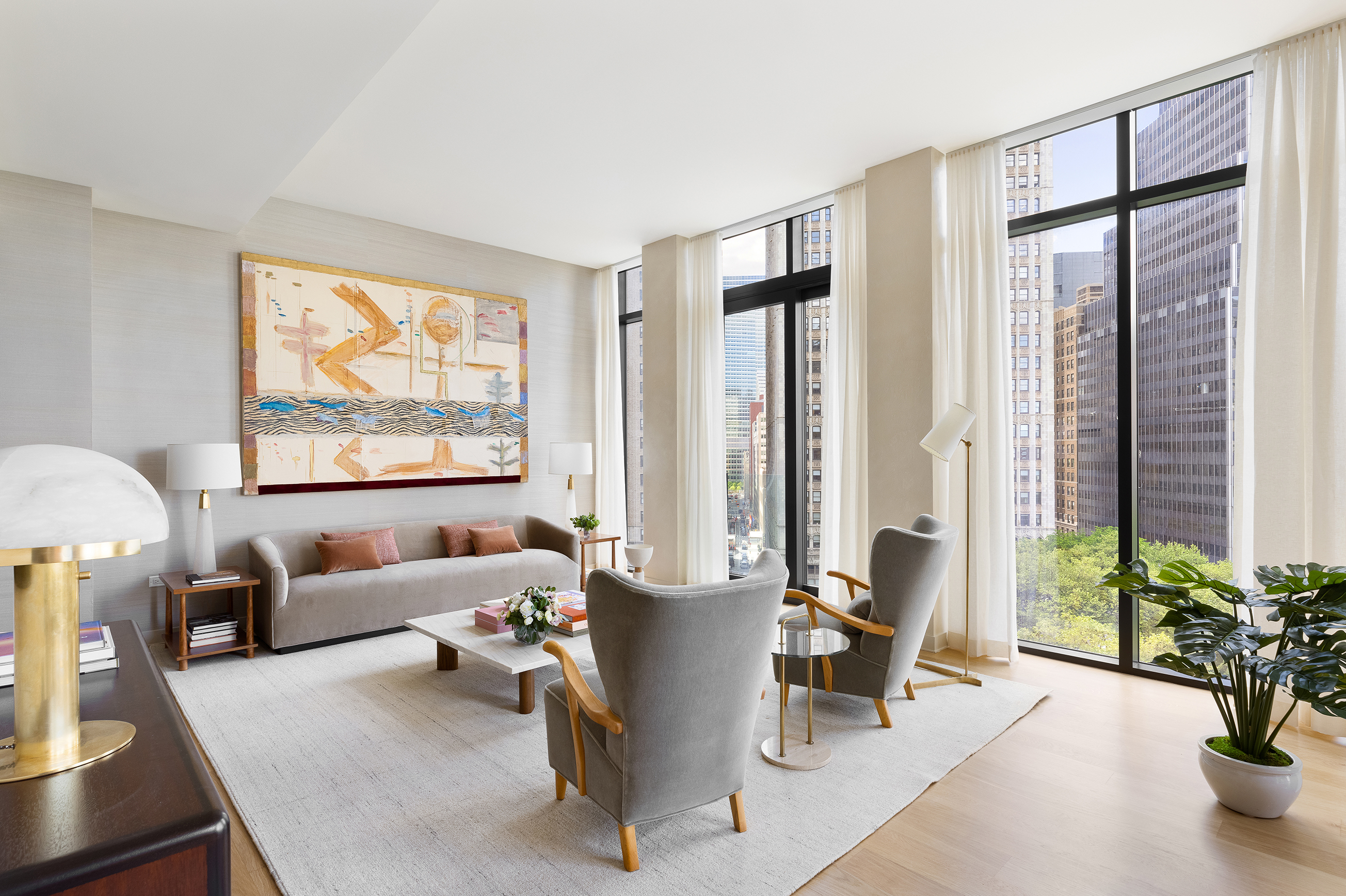 33 Park Row, Unit 6B Manhattan, NY 10038 - Photo 6 of 24 a living room with furniture and floor to ceiling windows