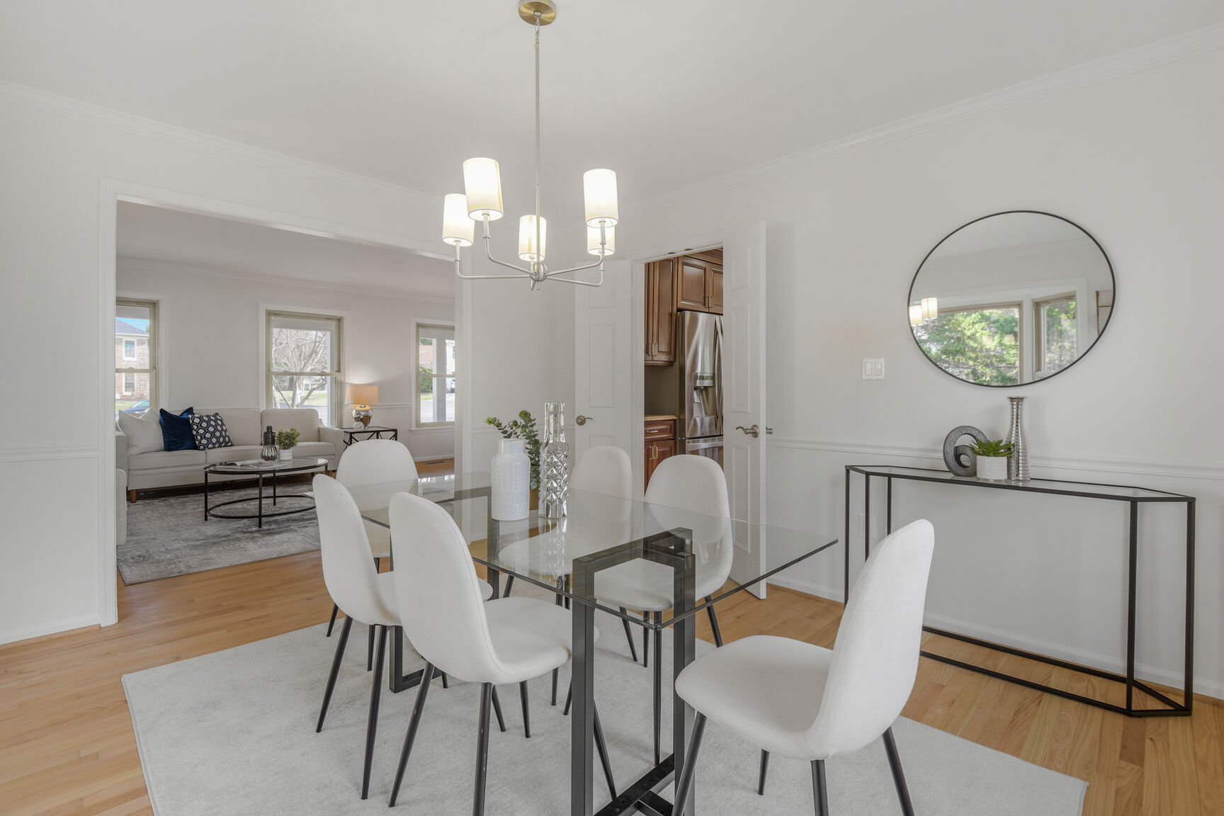 4008 Evangeline Terrace Olney, MD 20832 - Photo 14 of 54 a view of a dining room with furniture a chandelier and wooden floor