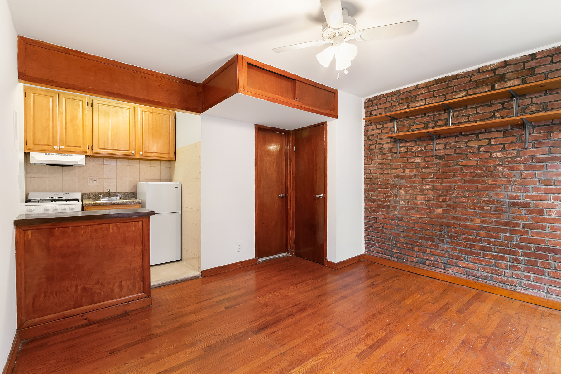 49 Perry Street, Unit 2E Manhattan, NY 10014 - Photo 2 of 3 a view of kitchen with stainless steel appliances granite countertop a stove and a refrigerator