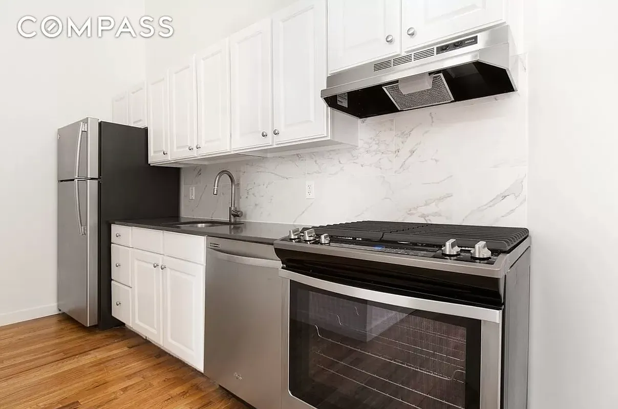 204 Huntington Street, Unit 2I Brooklyn, NY 11231 - Photo 3 of 7 a white stove top oven sitting inside of a kitchen