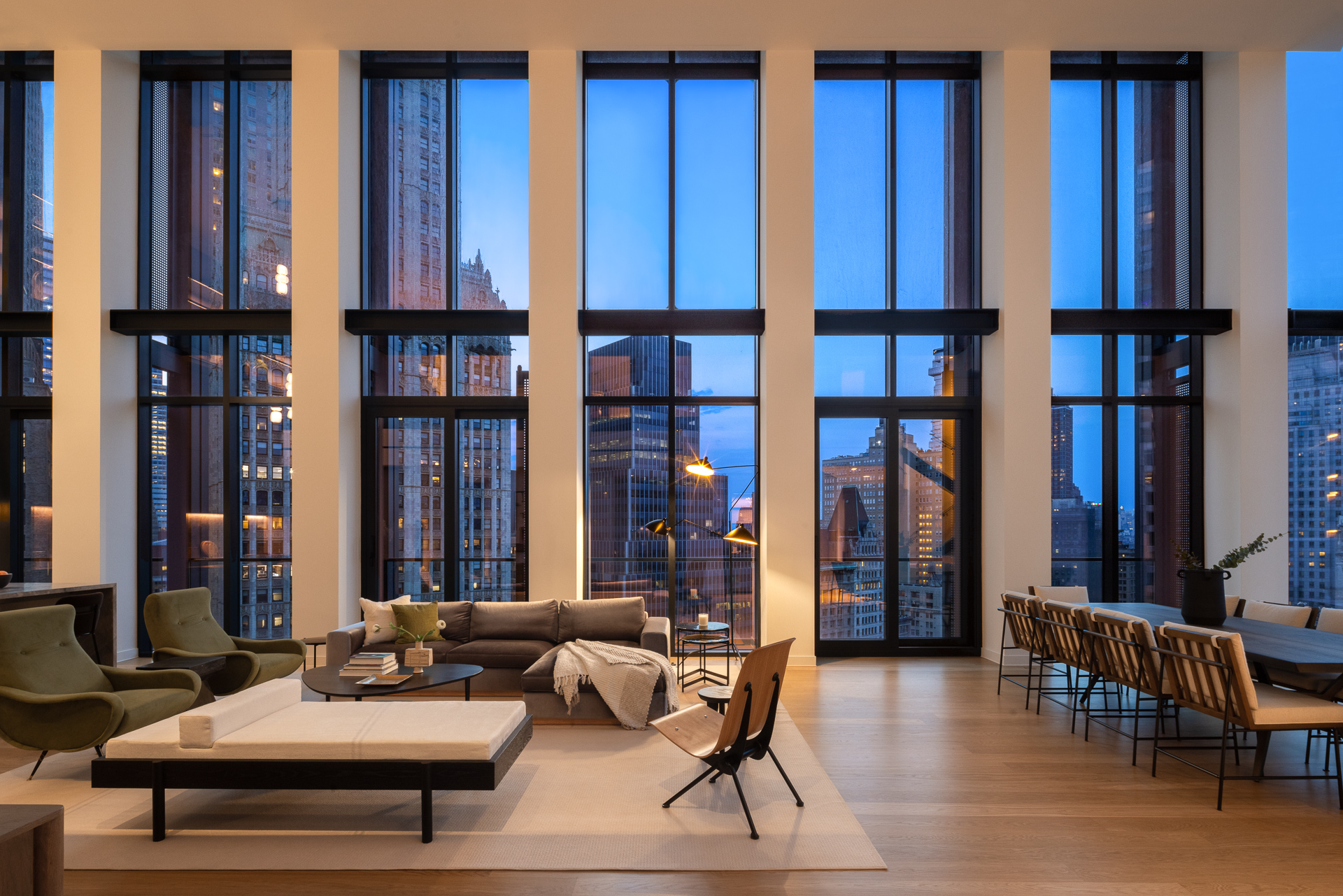 33 Park Row, Unit PH3 Manhattan, NY 10038 - Photo 27 of 30 a living room with furniture a window and kitchen view