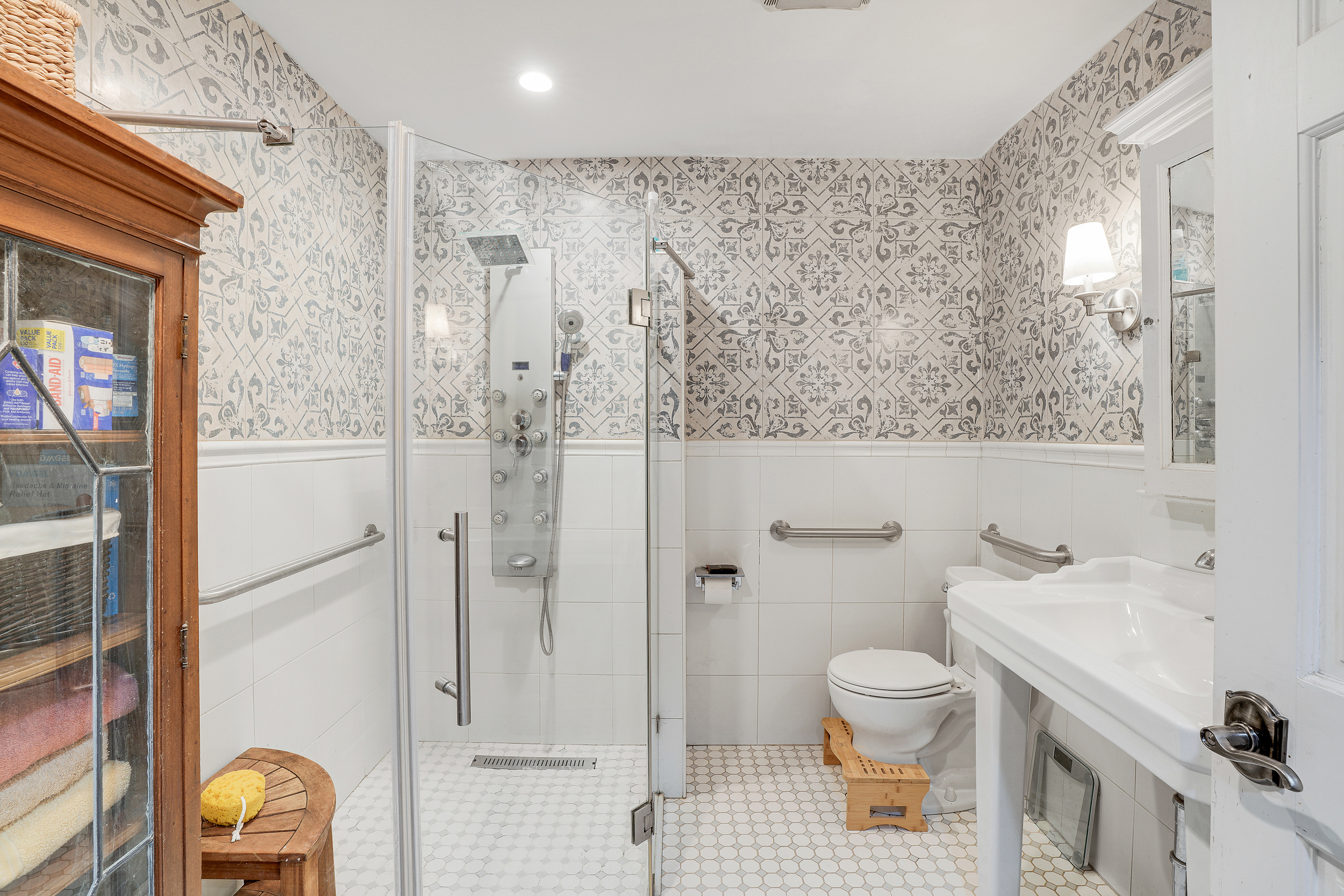 205 Edgecombe Avenue Manhattan, NY 10030 - Photo 7 of 21 a bathroom with a sink toilet and shower