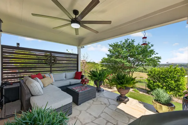 a outdoor living space with furniture and a potted plant