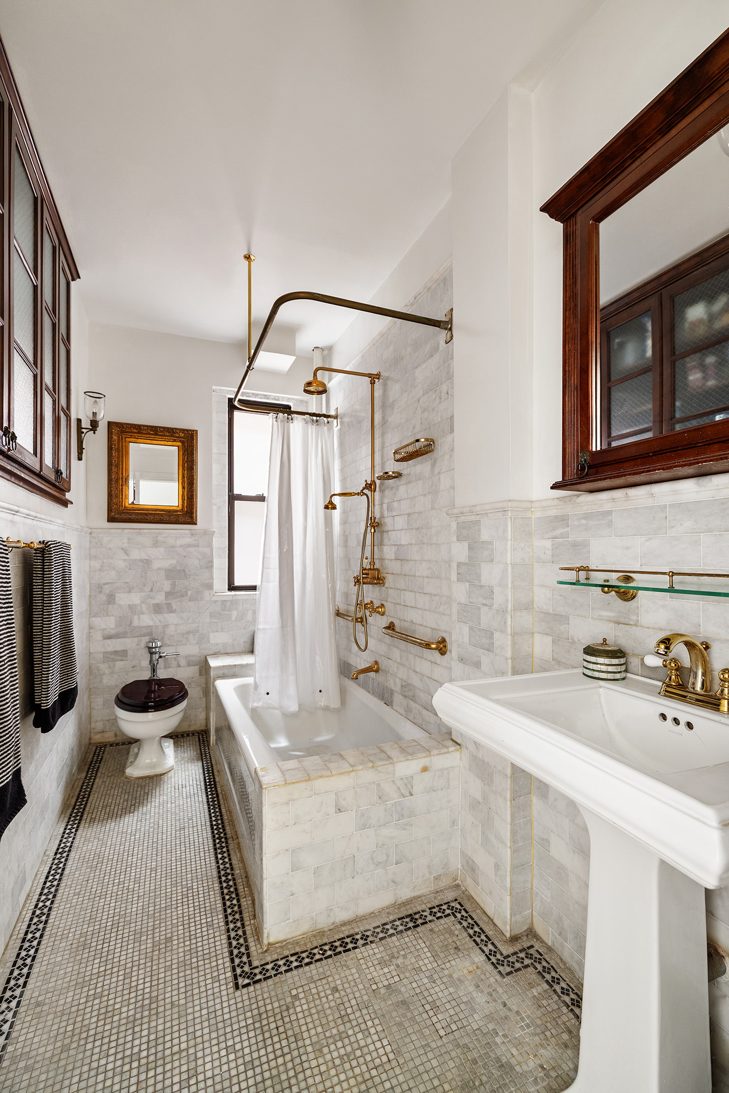 609 West 114th Street, Unit 54 Manhattan, NY 10025 - Photo 7 of 10 a bathroom with a sink a vanity and a mirror