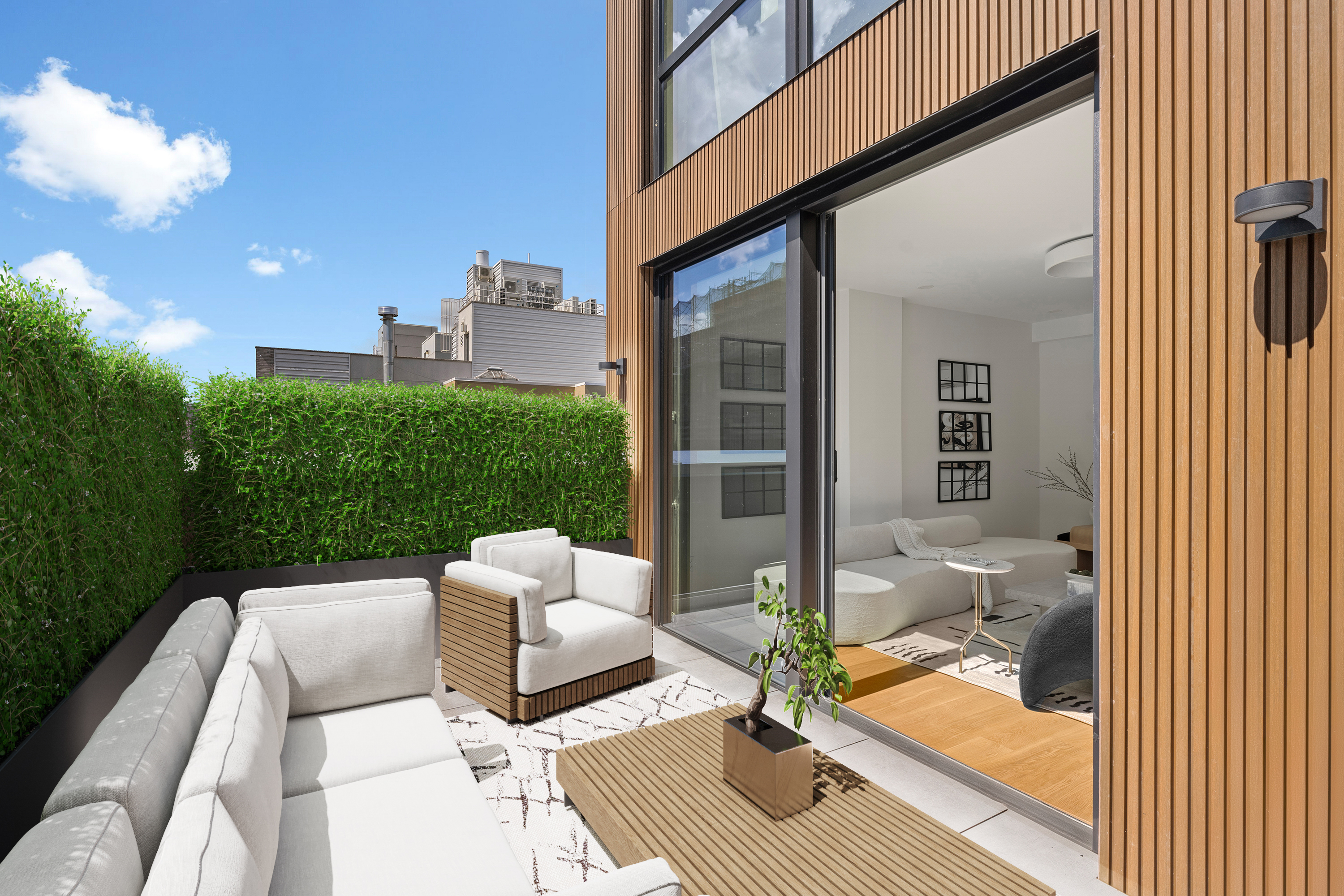 a view of a patio with couches table and chairs and potted plants