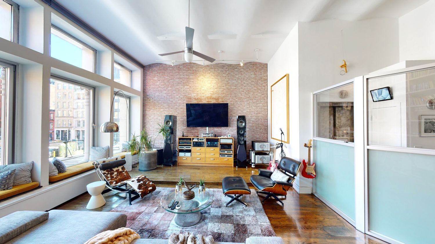 382 Lafayette Street, Unit 2 Manhattan, NY 10003 - Photo 3 of 19 a living room with furniture fireplace and a large window