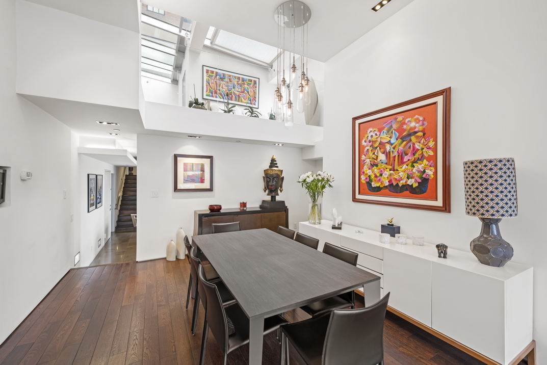 405 Broadway, Unit PH Manhattan, NY 10013 - Photo 4 of 17 a view of a dining room with furniture and wooden floor