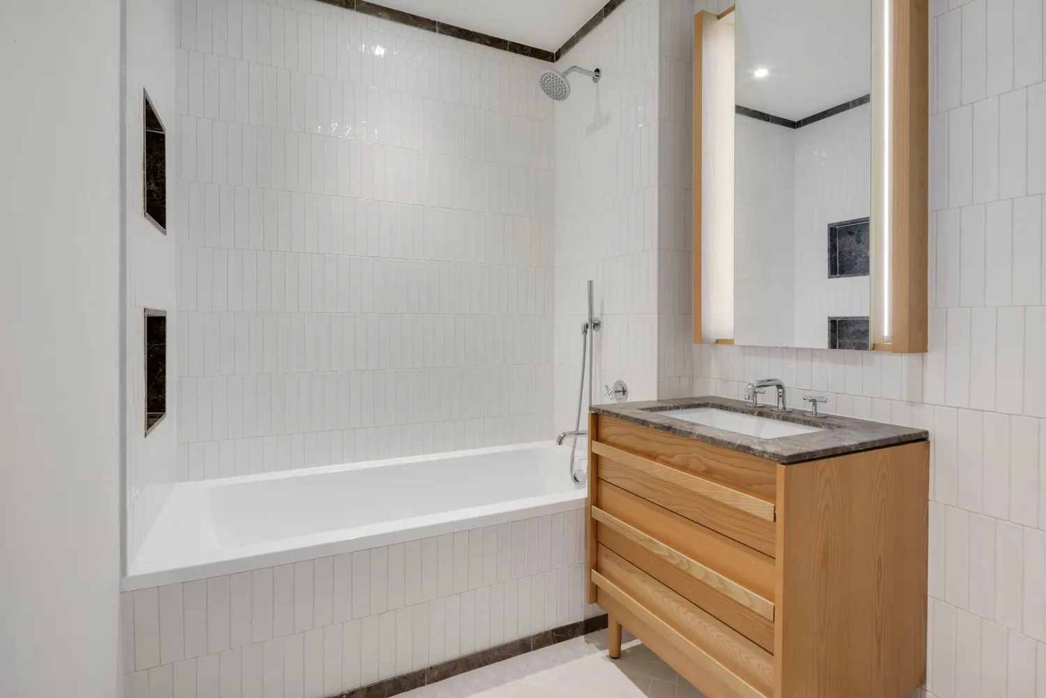 a bath room with a sink and a mirror