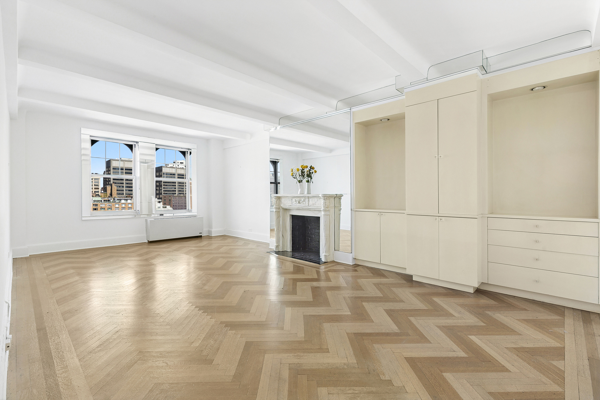 575 Park Avenue, Unit 1403 Manhattan, NY 10065 - Photo 2 of 15 a view of a livingroom with a fireplace