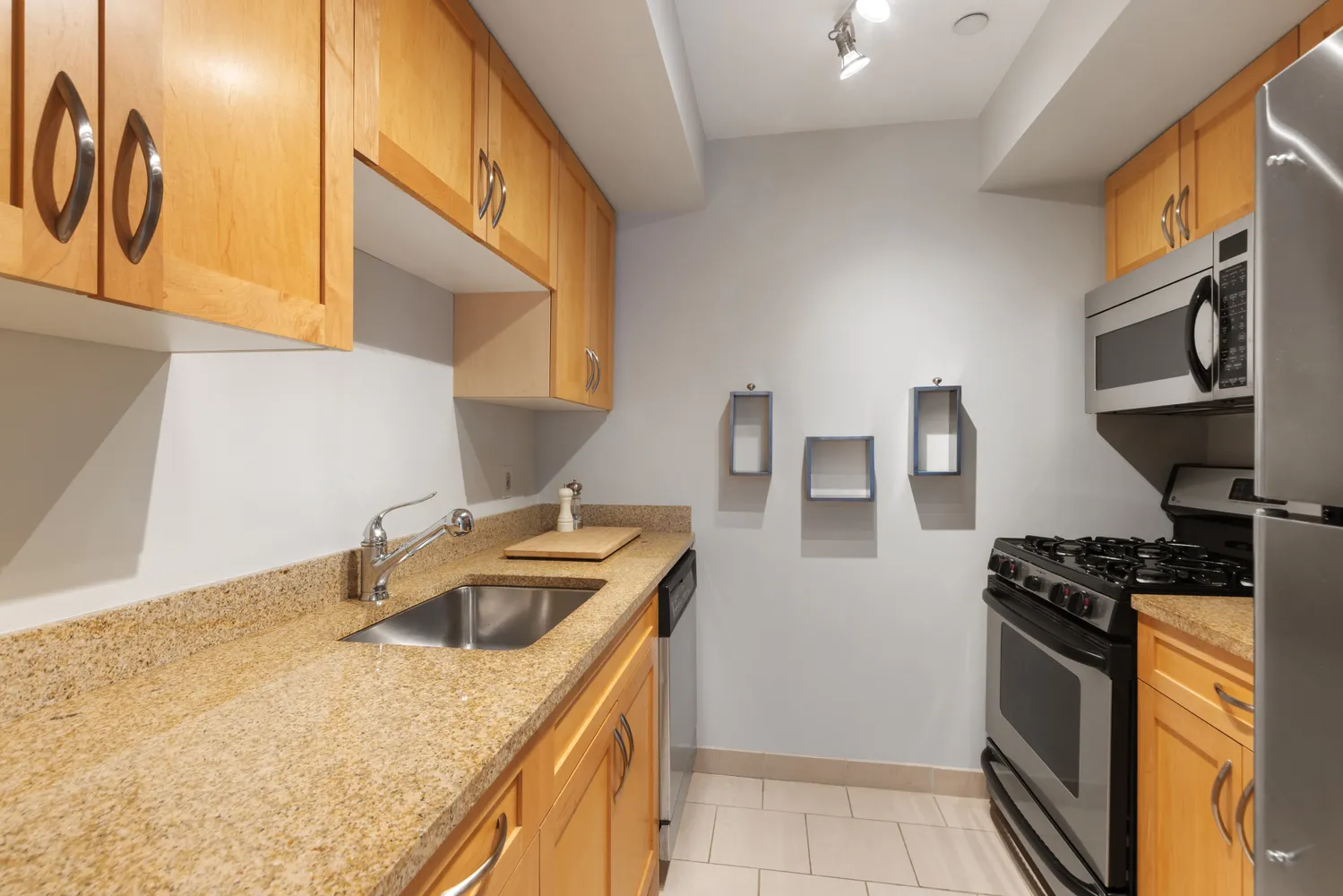 a kitchen that has a sink and a stove