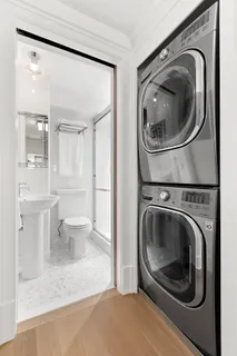 a utility room with sink dryer and washer