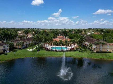 a view of a town with large trees
