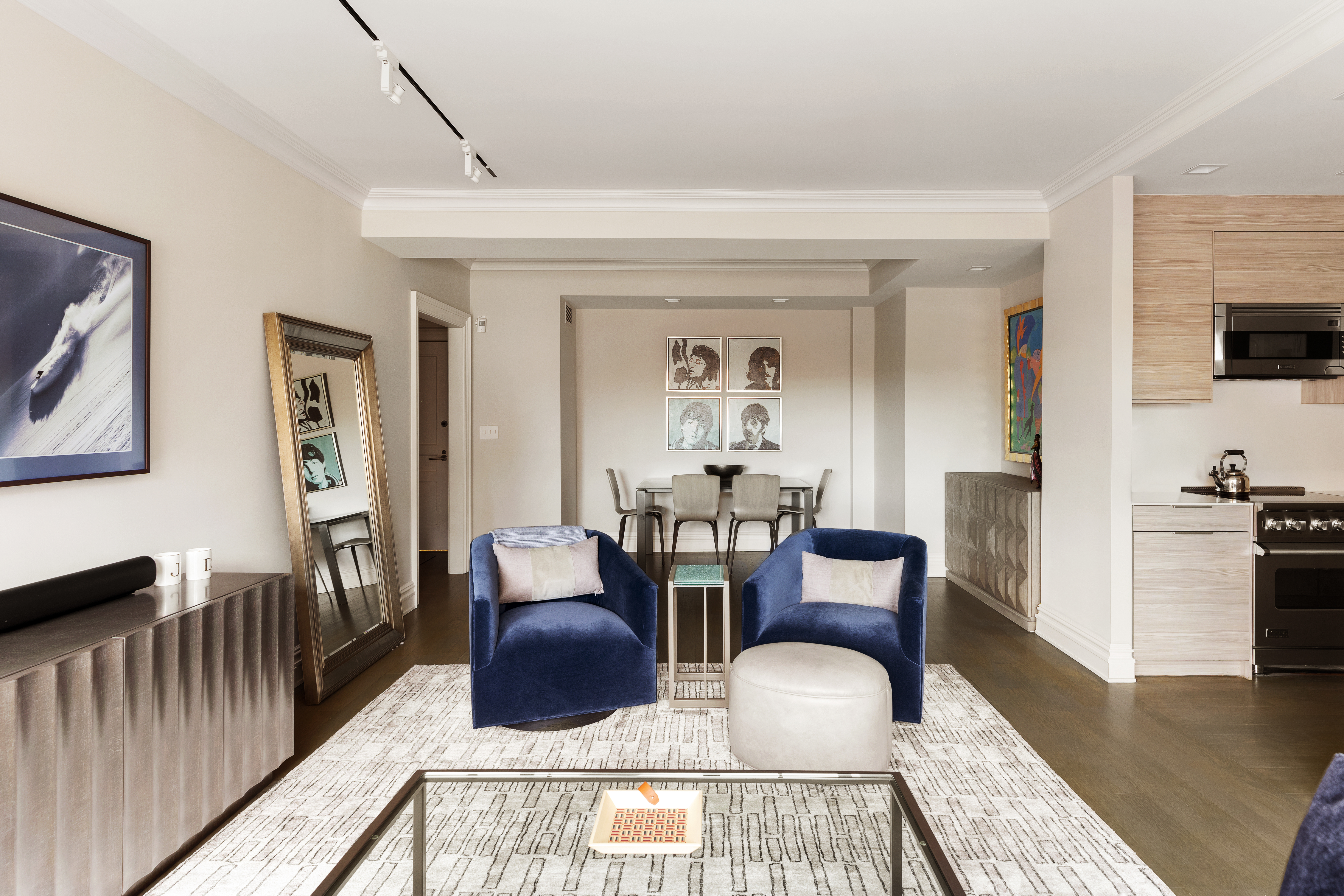 25 East 83rd Street, Unit 10D Manhattan, NY 10028 - Photo 4 of 17 a living room with furniture and a wooden floor