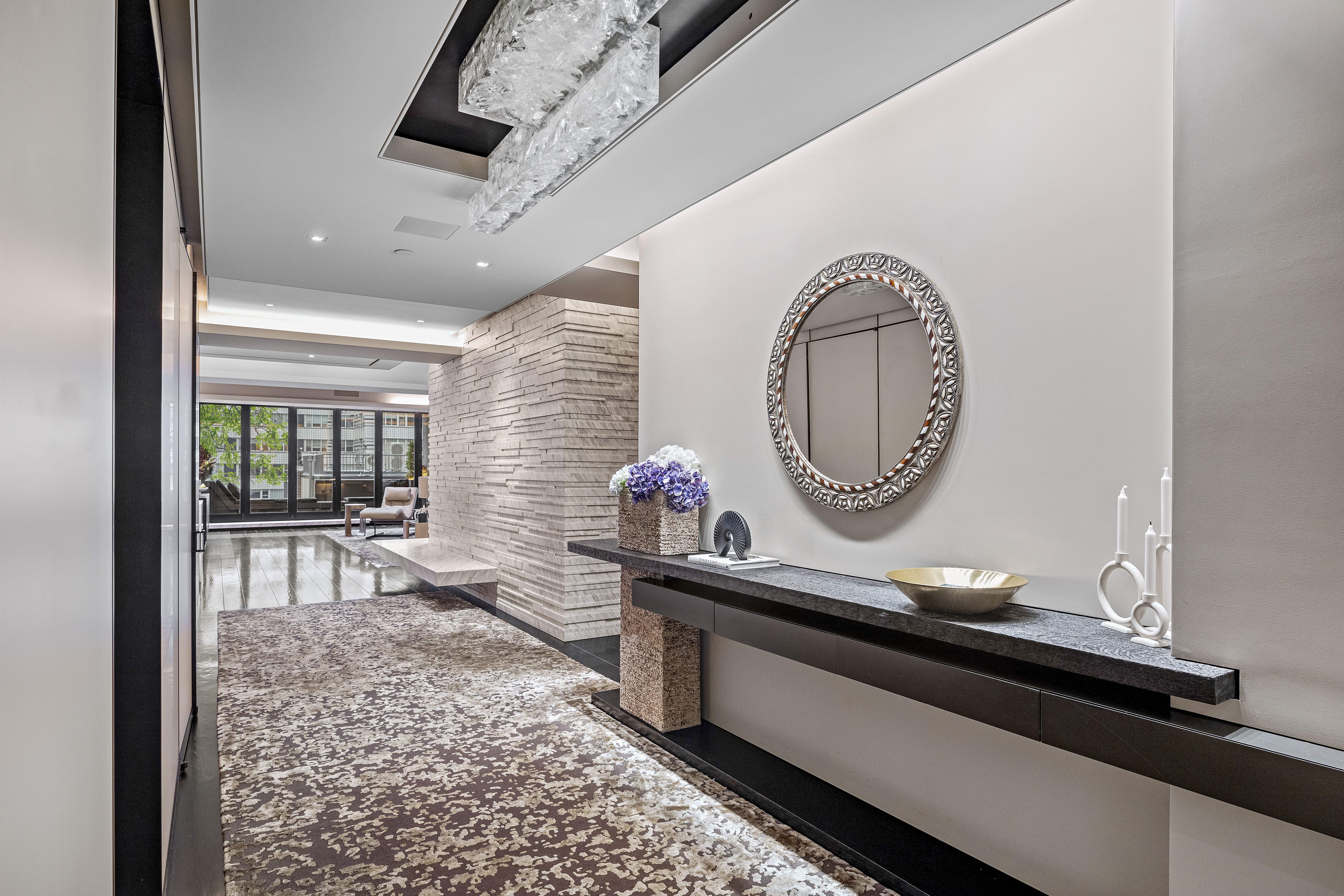 219 East 67th Street, Unit 5 Manhattan, NY 10065 - Photo 6 of 18 a living room with a wooden floor and a large window