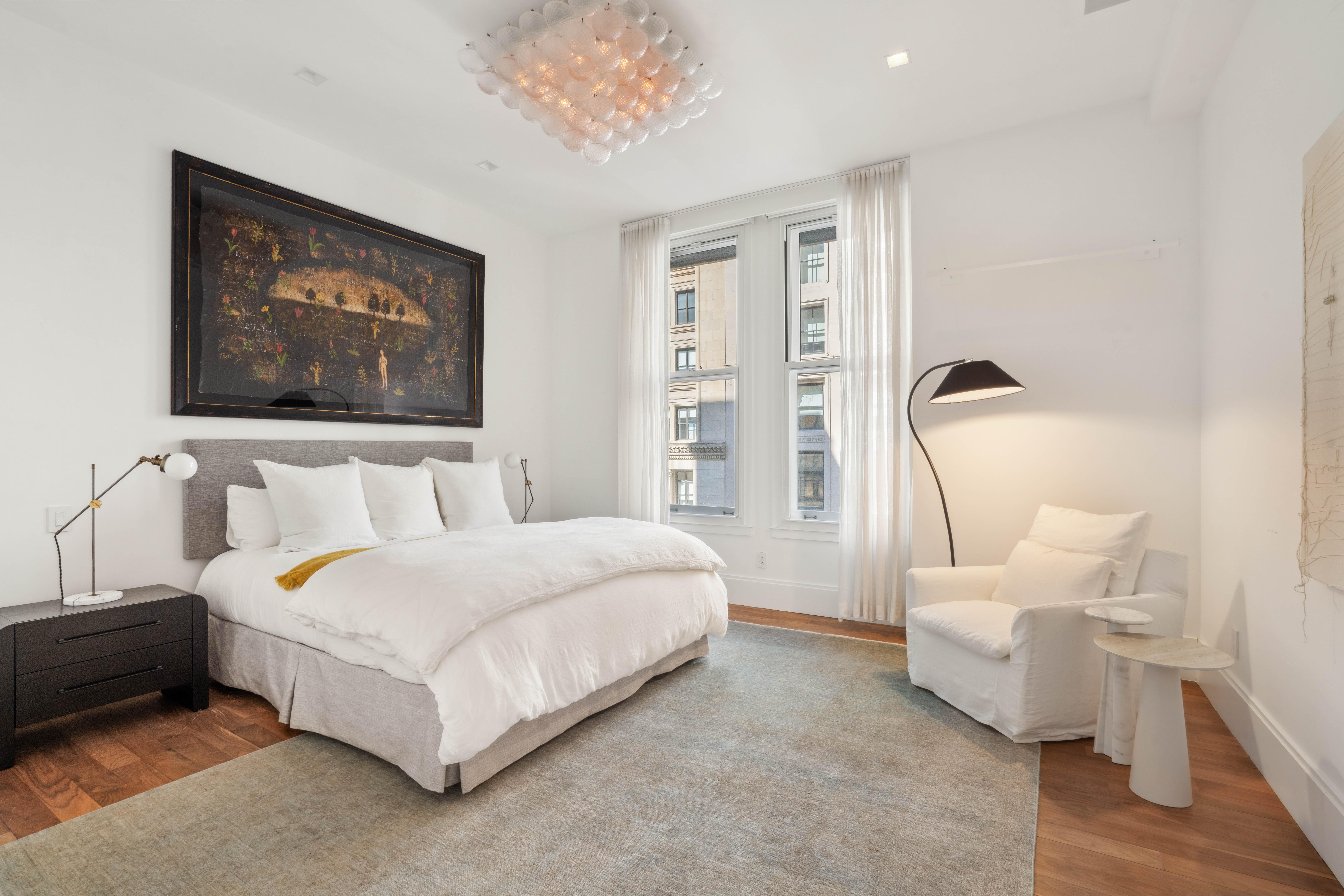 141 5th Avenue, Unit 4C Manhattan, NY 10010 - Photo 4 of 16 a spacious bedroom with a bed and a couch