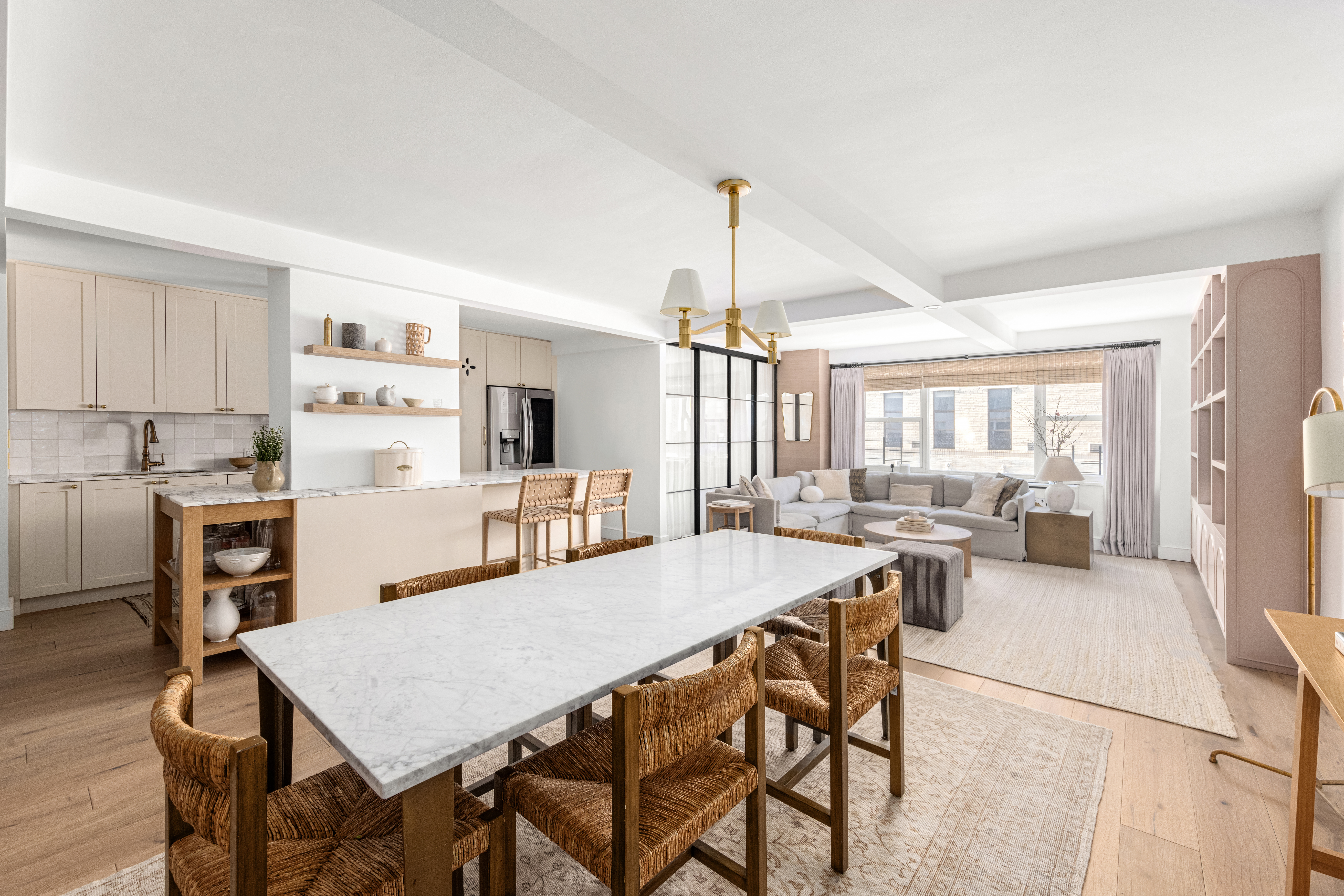 135 East 83rd Street, Unit 8/9C Manhattan, NY 10028 - Photo 2 of 15 a large kitchen with a table and chairs