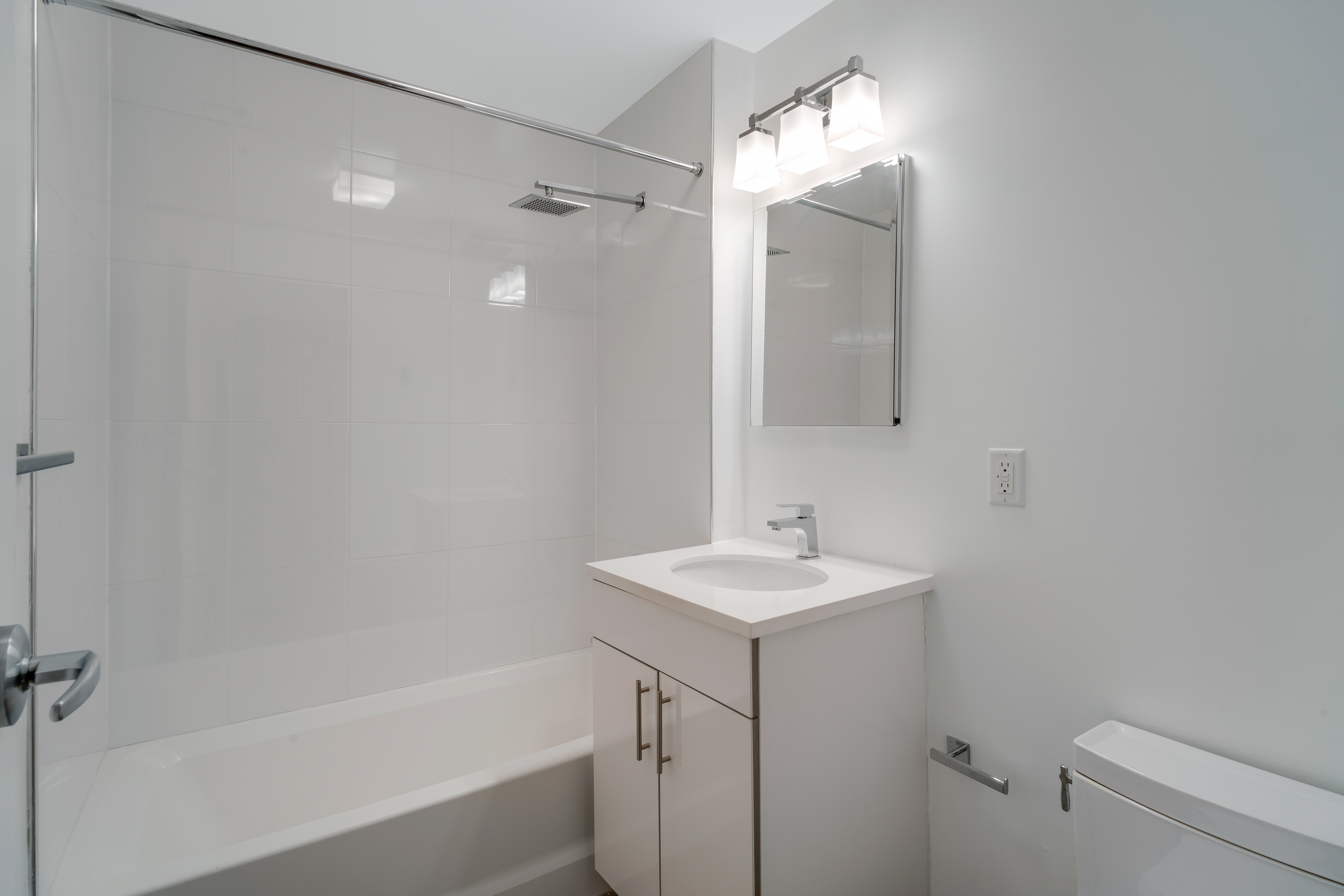 228 West 75th Street, Unit 4 Manhattan, NY 10023 - Photo 8 of 13 a bathroom with a sink a toilet and shower