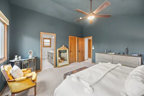 a bedroom with a bed and window