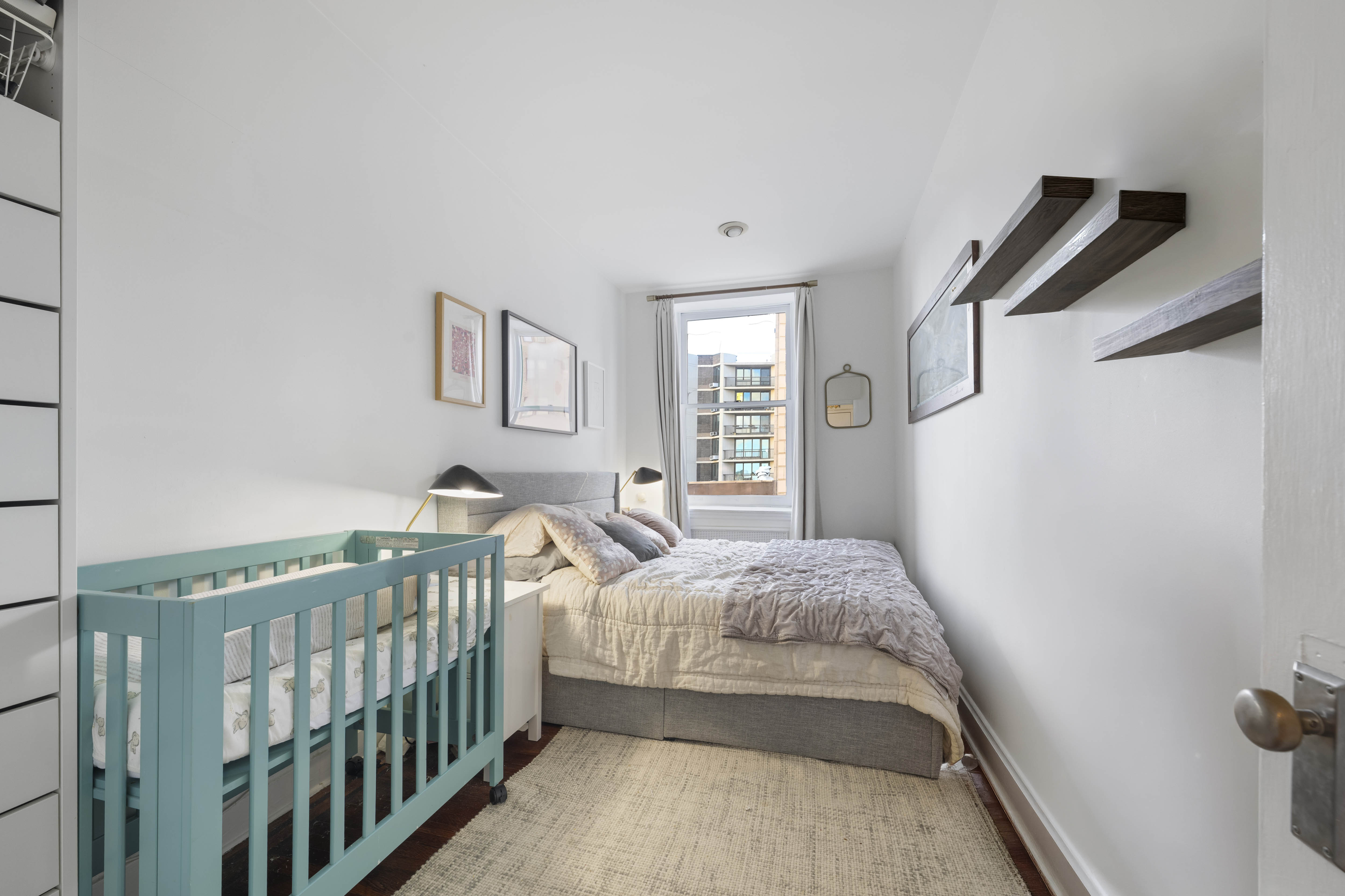 21 Monroe Place, Unit 5F Brooklyn, NY 11201 - Photo 6 of 10 a bedroom with a bed and a window
