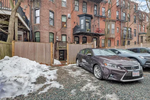 a view of a brick house with many windows