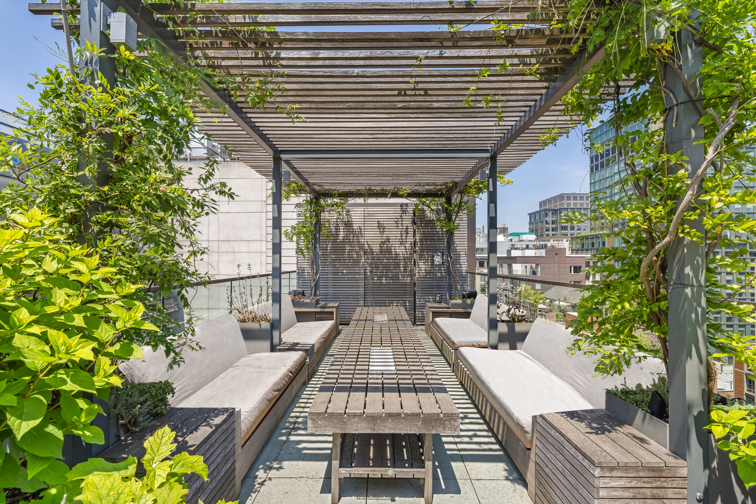 15 Renwick Street, Unit PH2 Manhattan, NY 10013 - Photo 5 of 23 a view of a patio with table and chairs and potted plants