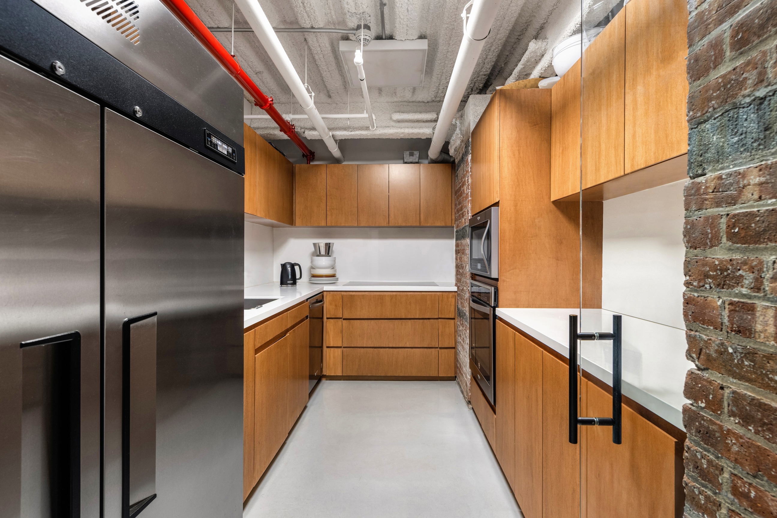 64 White Street, Unit RETAIL Manhattan, NY 10013 - Photo 19 of 21 a kitchen with granite countertop a refrigerator and a stove