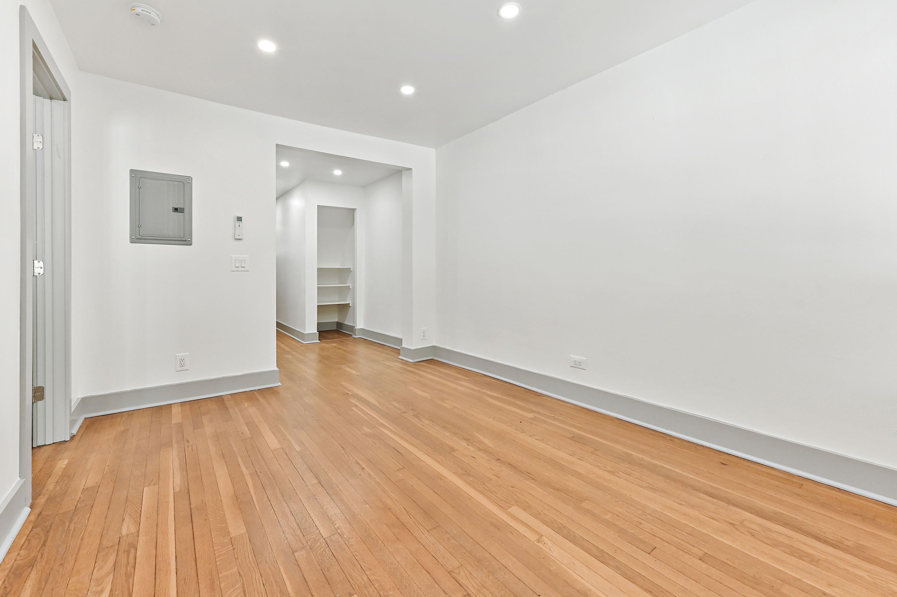 5823 Fieldston Road, Unit 1A Bronx, NY 10471 - Photo 9 of 26 wooden floor in an empty room