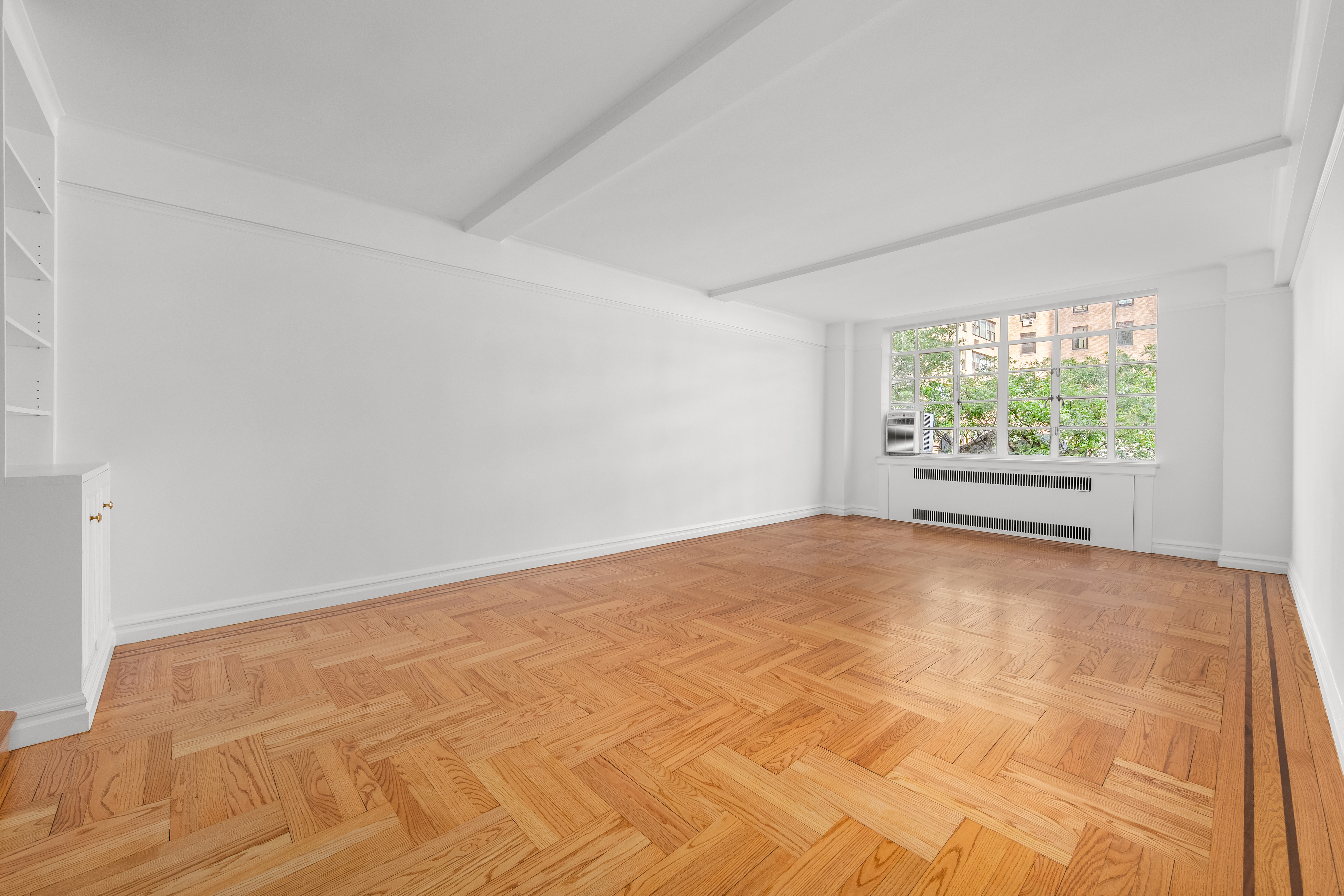 110 East 87th Street, Unit 5C Manhattan, NY 10128 - Photo 2 of 13 a view of an empty room with a window
