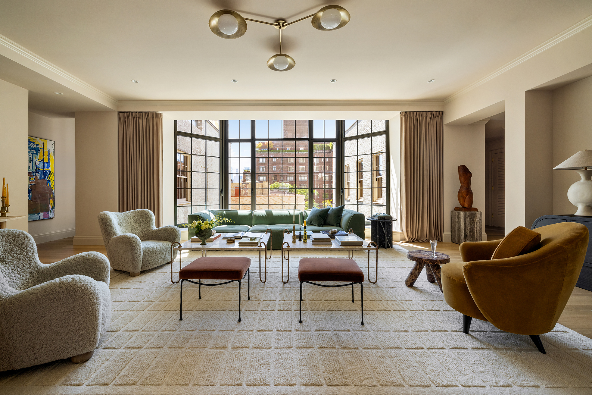 118 West 13th Street, Unit PH Manhattan, NY 10011 - Photo 2 of 31 a living room with furniture and a large window