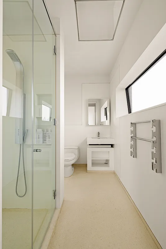 100 11th Avenue, Unit 16A Manhattan, NY 10011 - Photo 9 of 17 a bathroom with a shower and a toilet