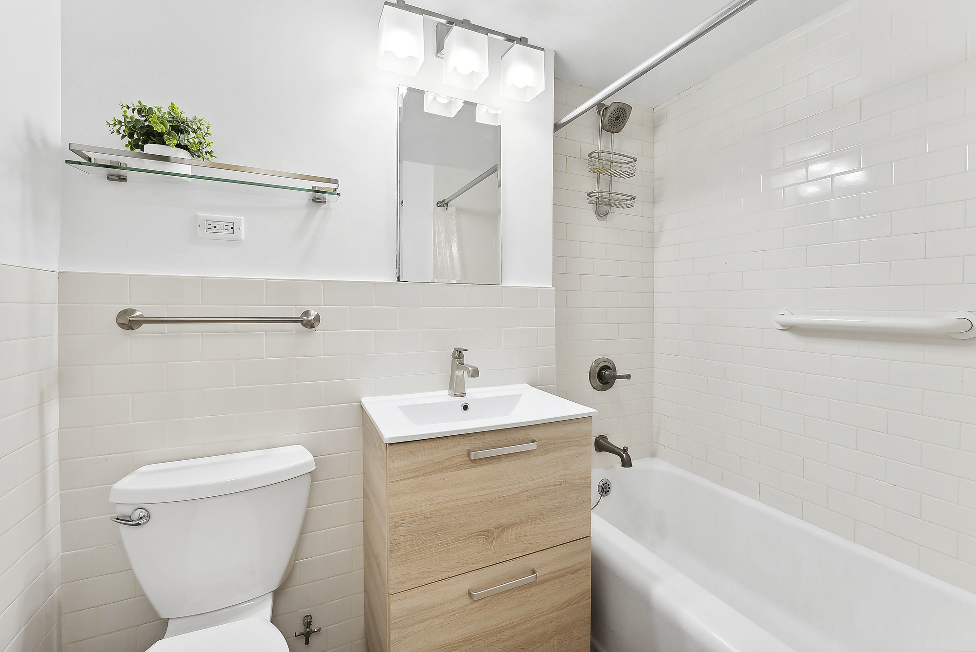 2 5th Avenue, Unit 2U Manhattan, NY 10011 - Photo 5 of 13 a bathroom with a sink a toilet and shower
