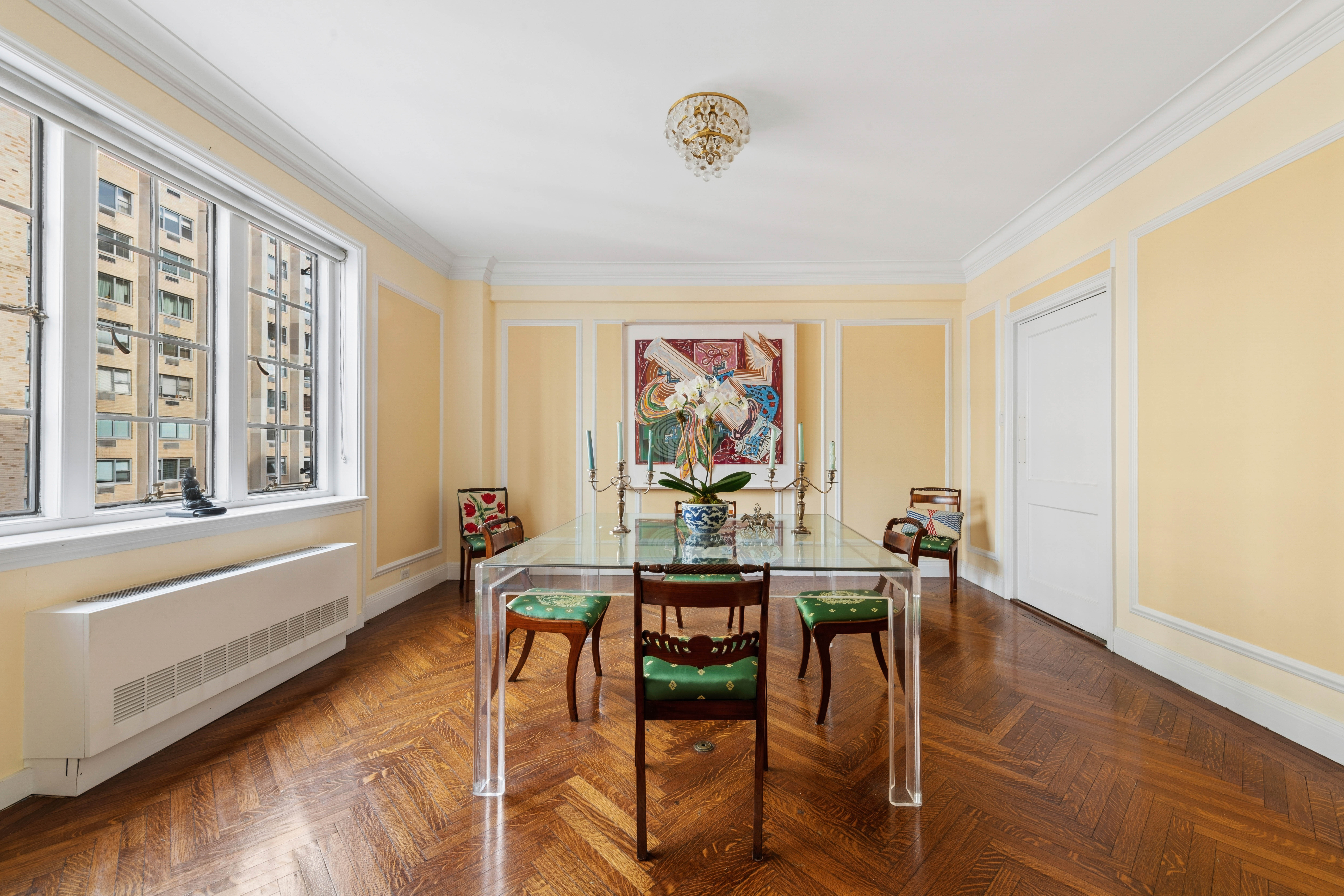 520 East 86th Street, Unit 9B Manhattan, NY 10028 - Photo 5 of 18 a workspace with furniture window and wooden floor