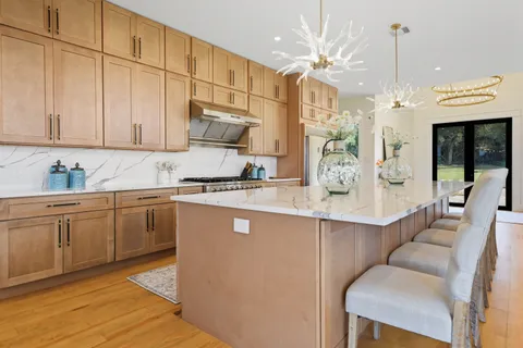 a kitchen with a sink cabinets and window