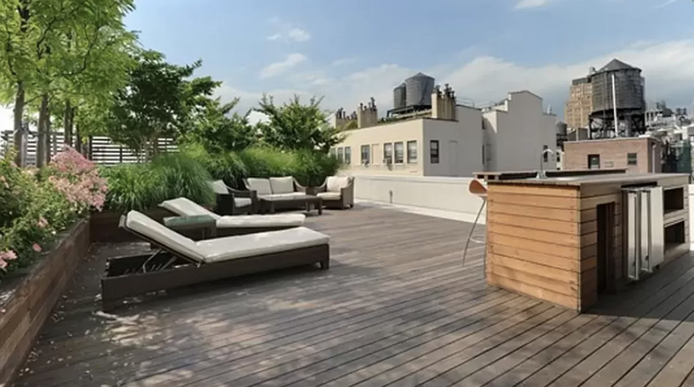 133 West 22nd Street, Unit 7H Manhattan, NY 10011 - Photo 19 of 21 a view of a living room and kitchen floor to ceiling window and wooden floor